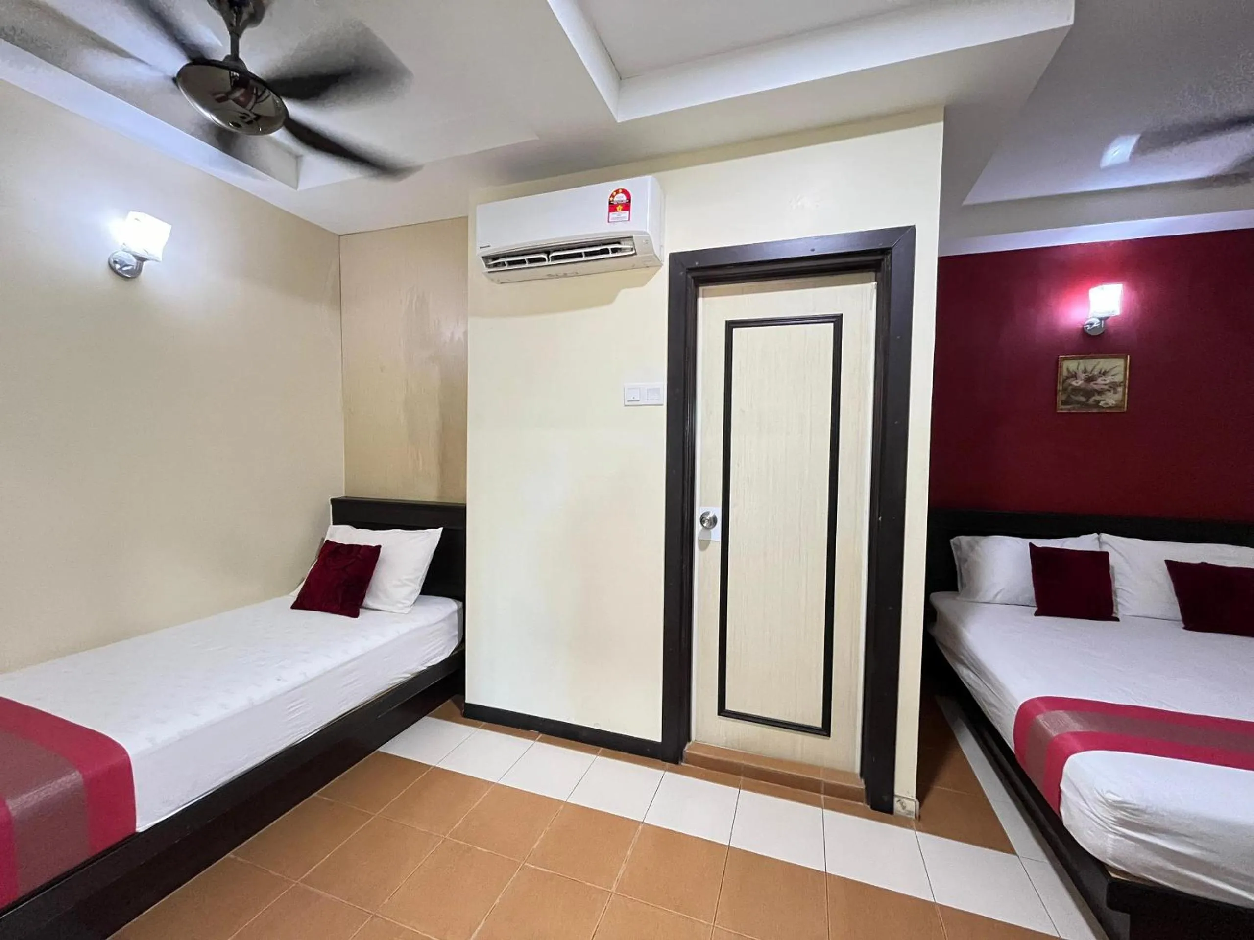 Bed in Sera Sentosa Inn