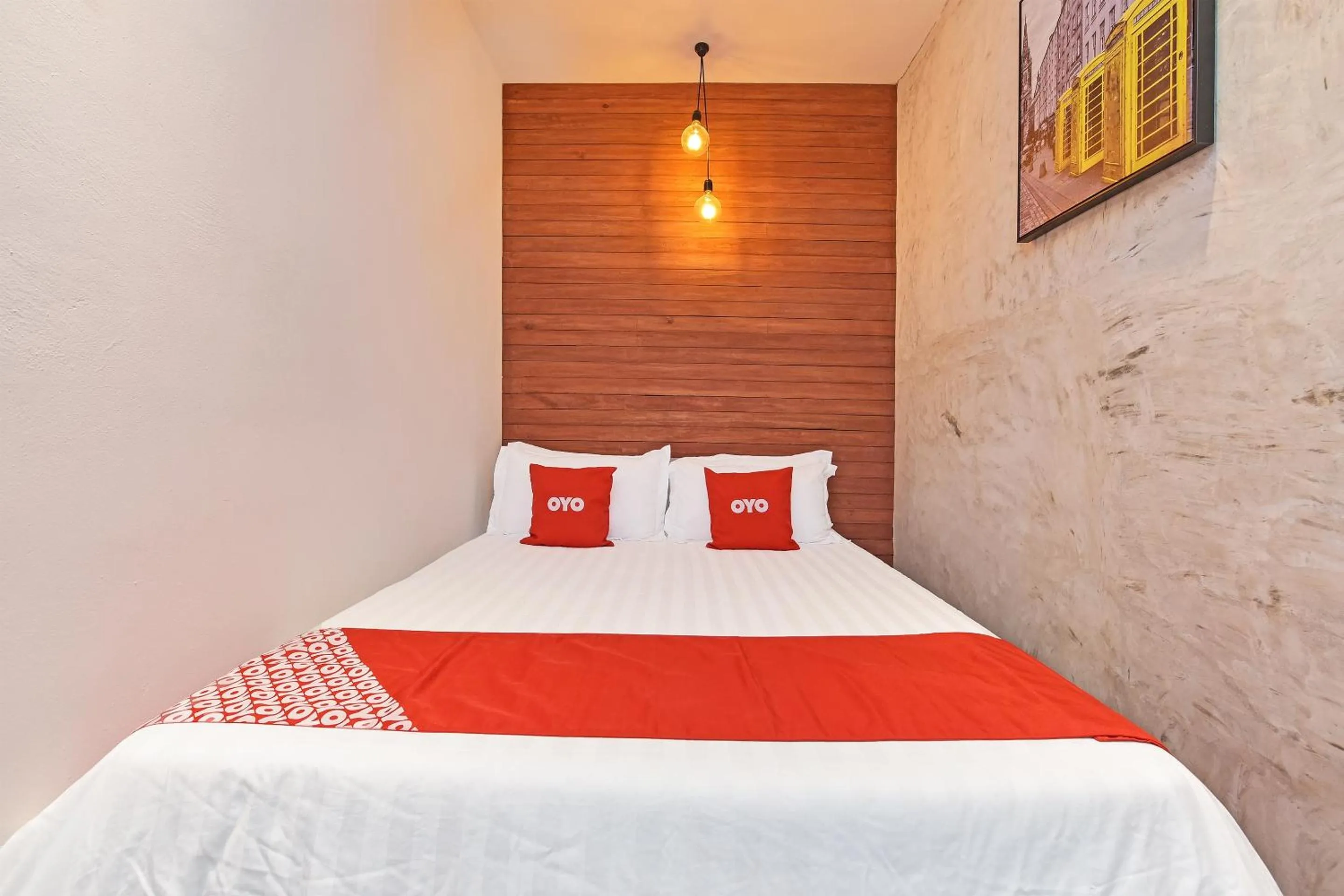 Bedroom in OYO 90662 The 1975 Hotel Empire