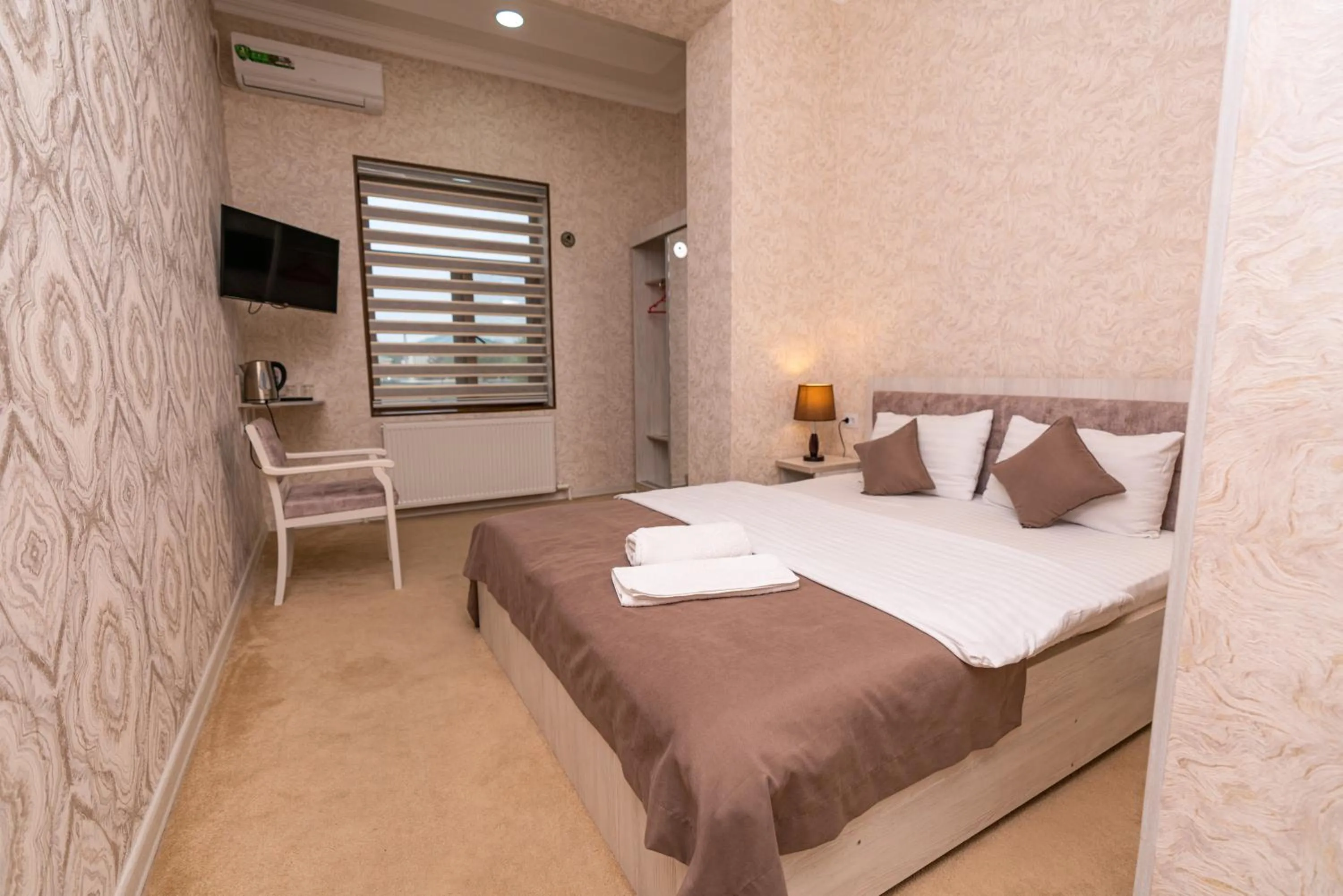 Bed in Osiyo Plaza Hotel