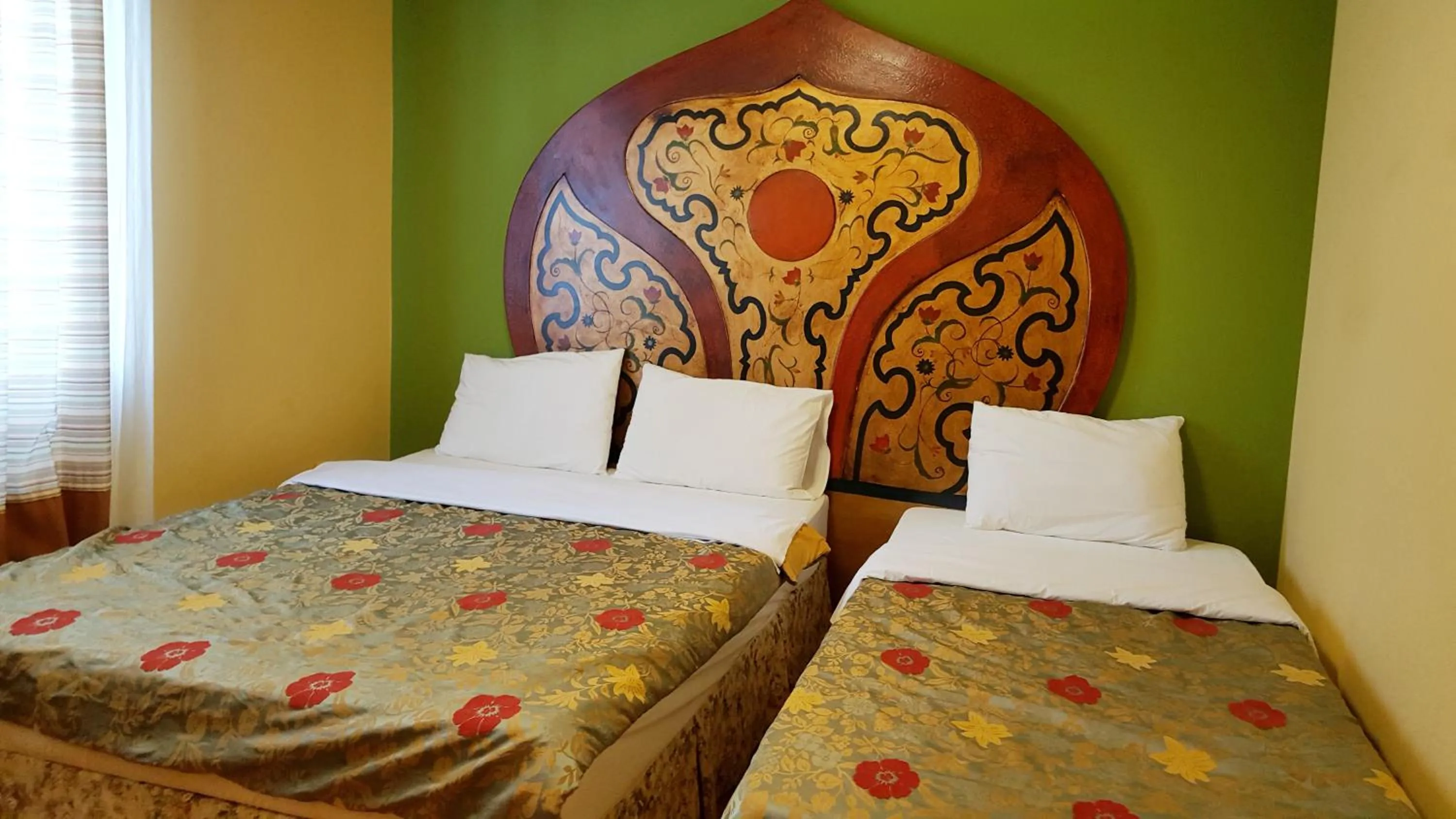 Bed in Elf Resort Hotel