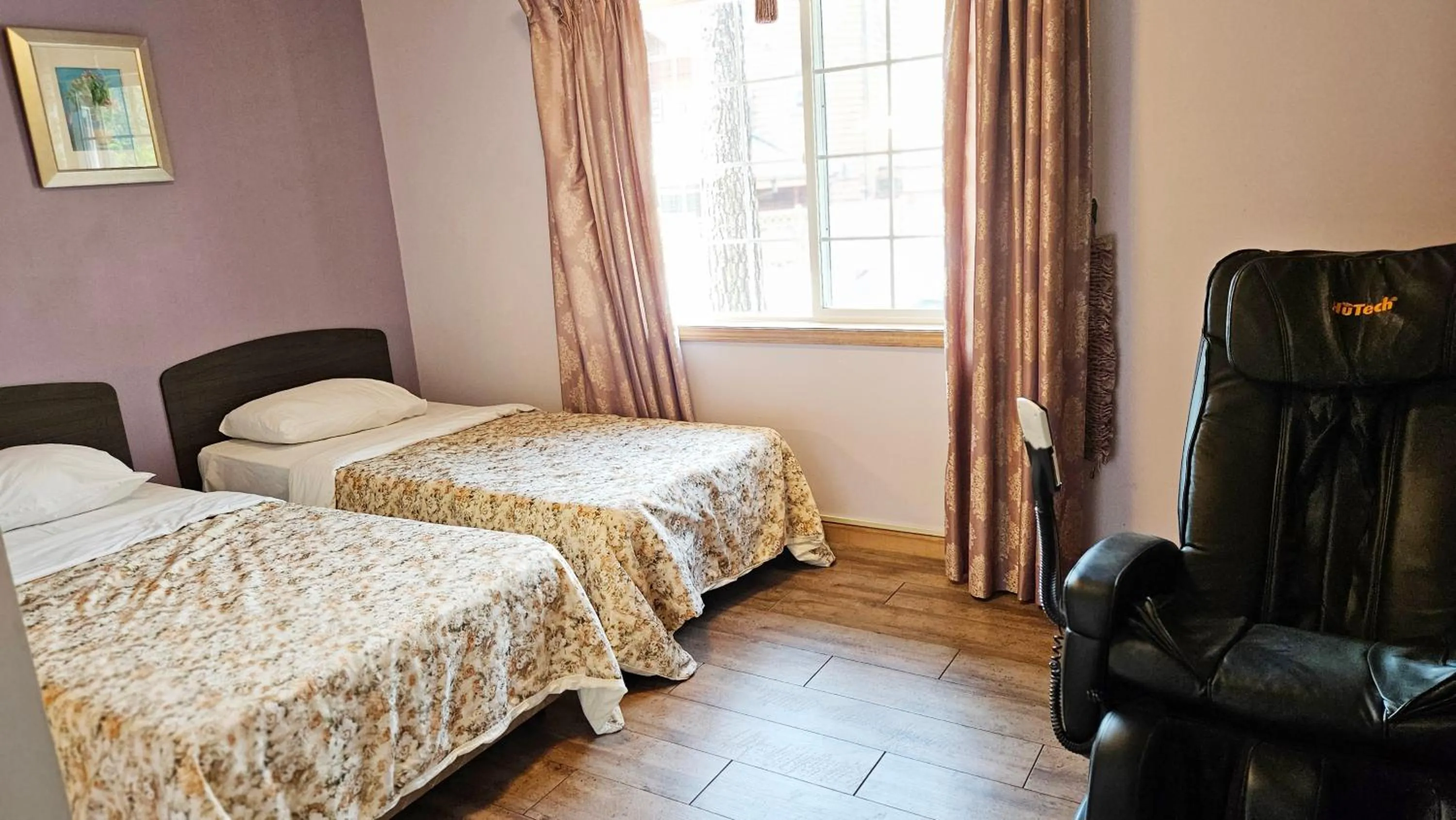 Bed in Elf Resort Hotel