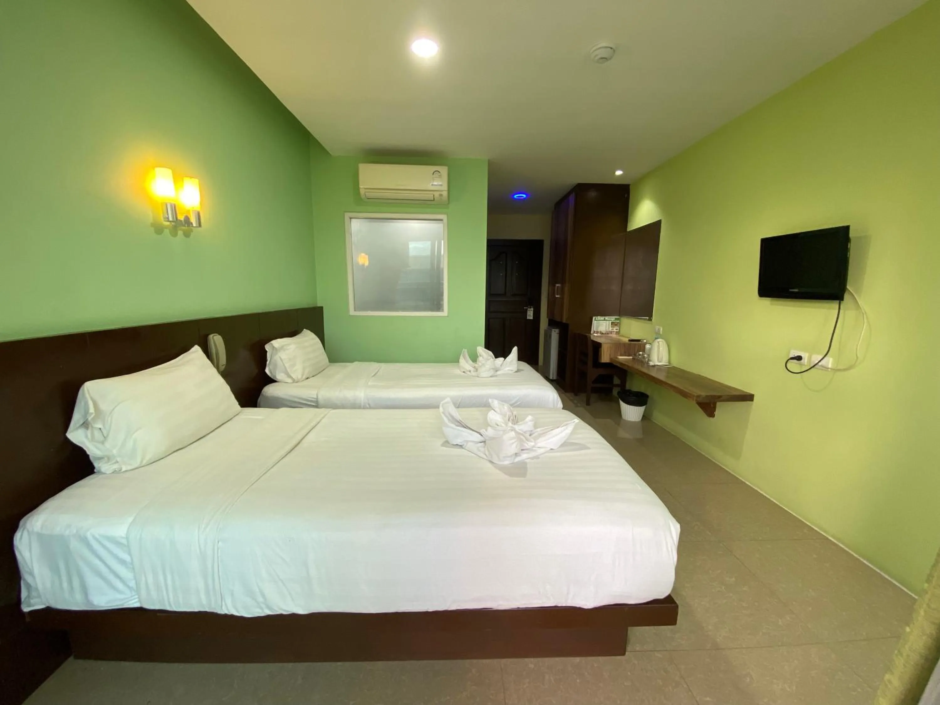 Bed in 77 Patong Hotel & Spa