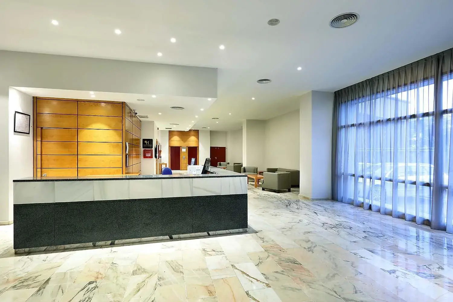 Lobby or reception in Exe Isla Cartuja Lobby or reception in Exe Isla Cartuja