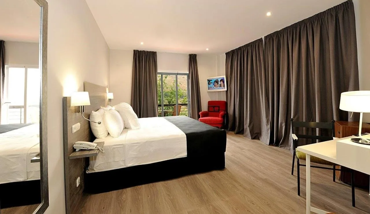 Bed in Hotel Salobreña Suites