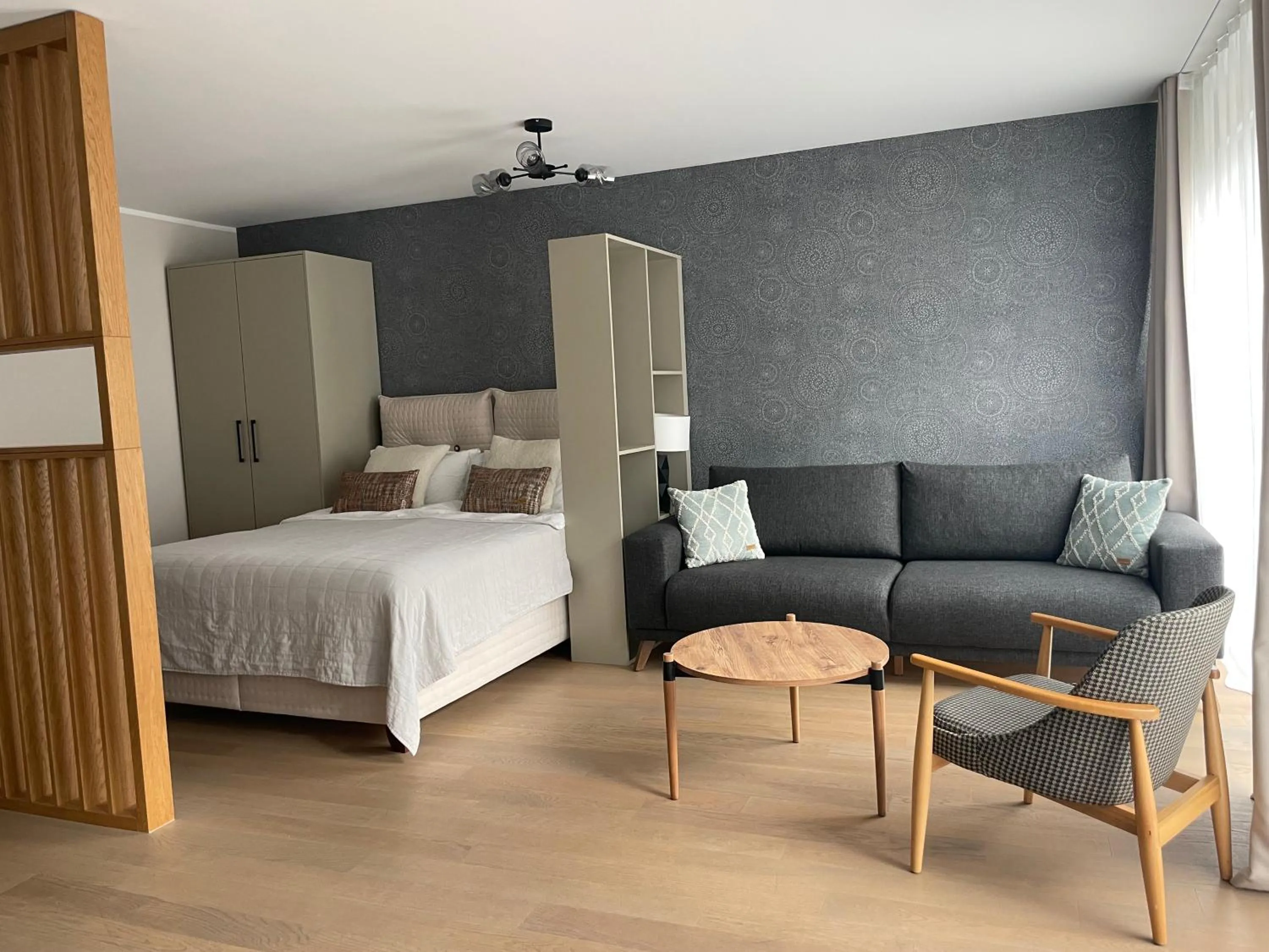 Seating area, Bed in Lamira Serviced Apartments Zurich City