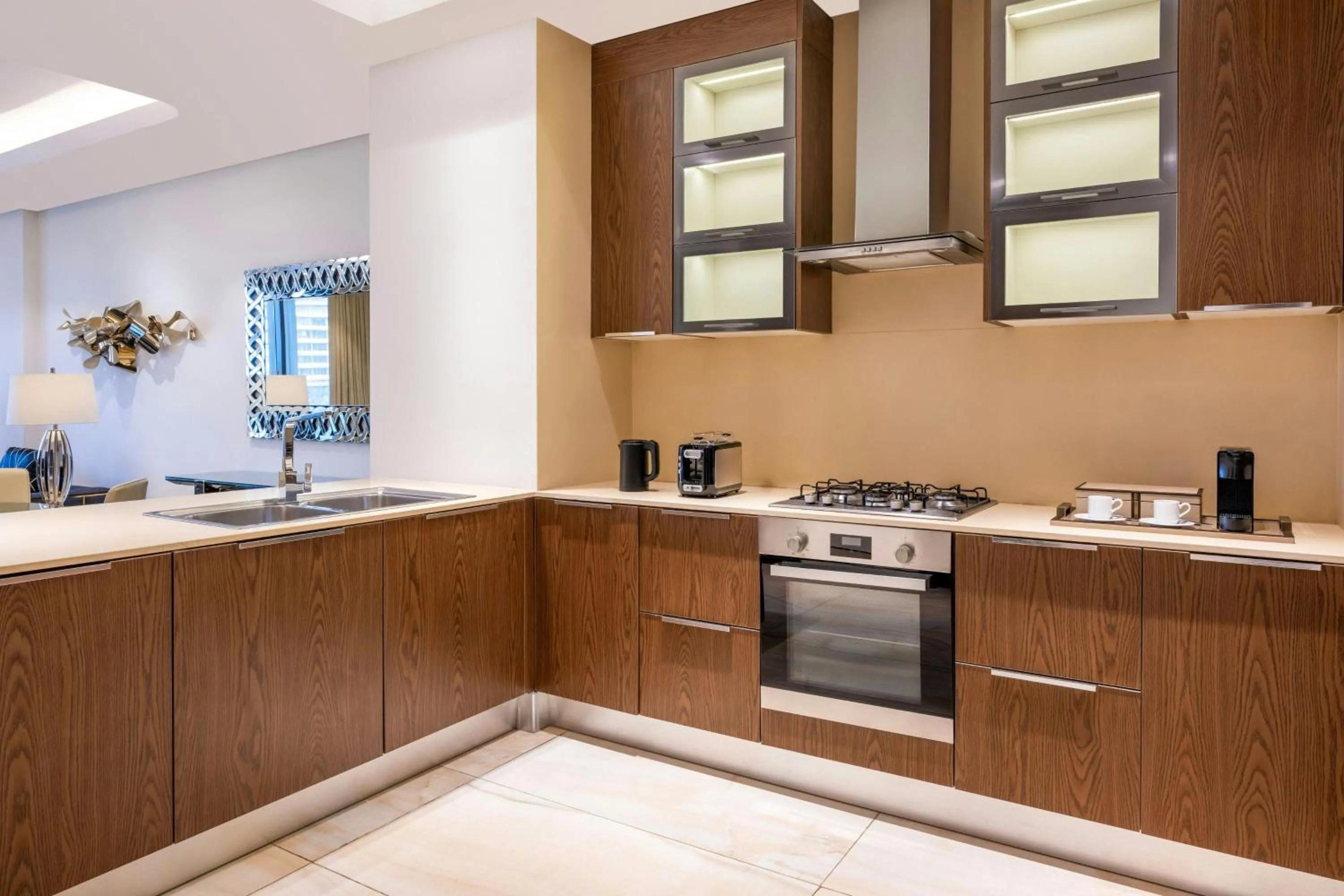 Kitchen or kitchenette in Agora, Doha, Autograph Collection