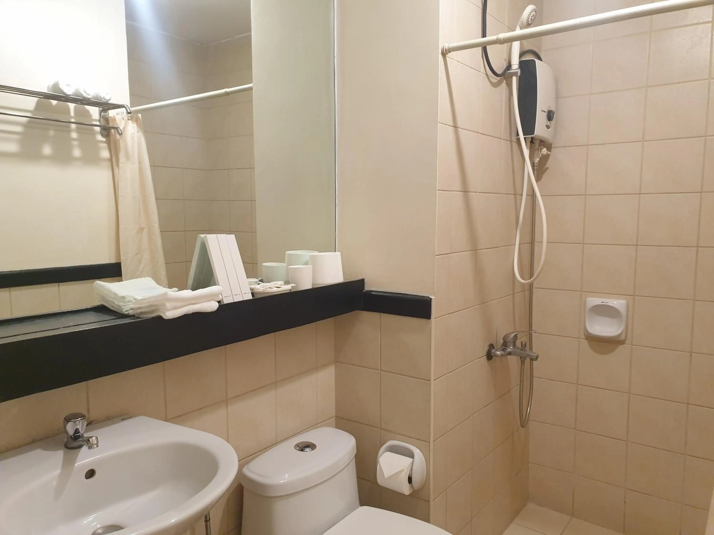 Shower in Spacious Penthouse Near NAIA with 24-7 Convenience
