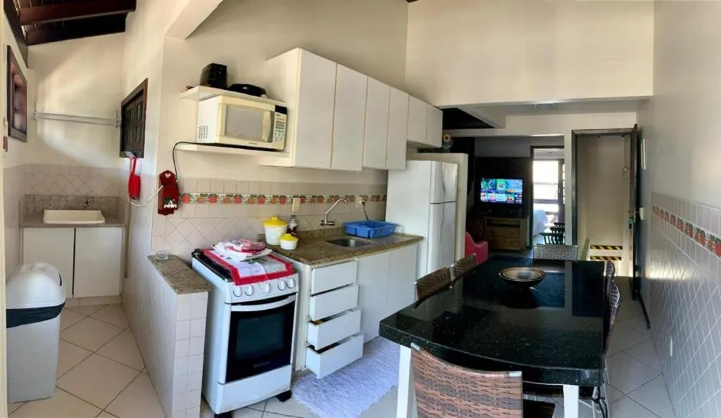 Kitchen or kitchenette in Pousada Solar dos Girassóis