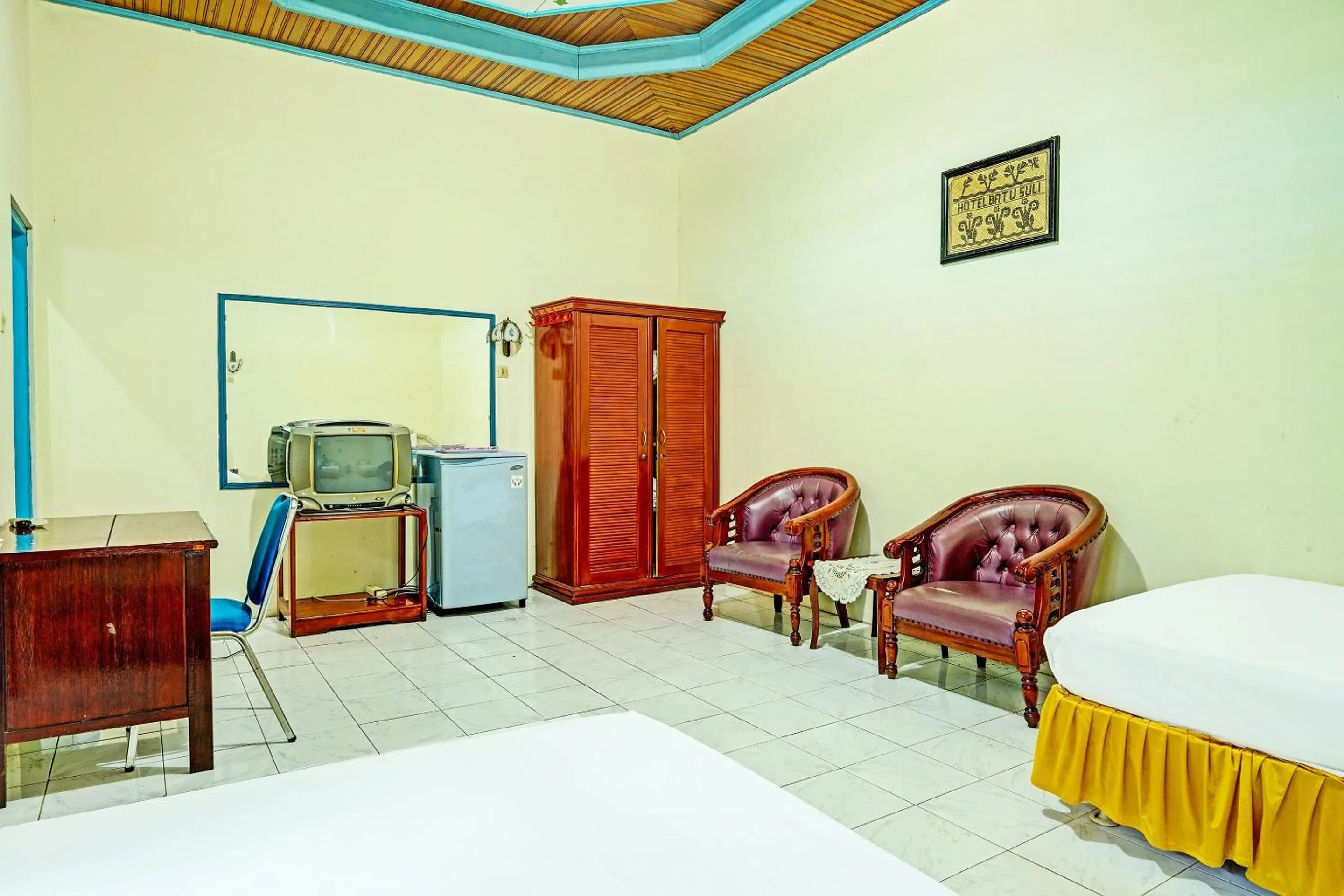 Bedroom in Capital O 91806 Hotel Batu Suli