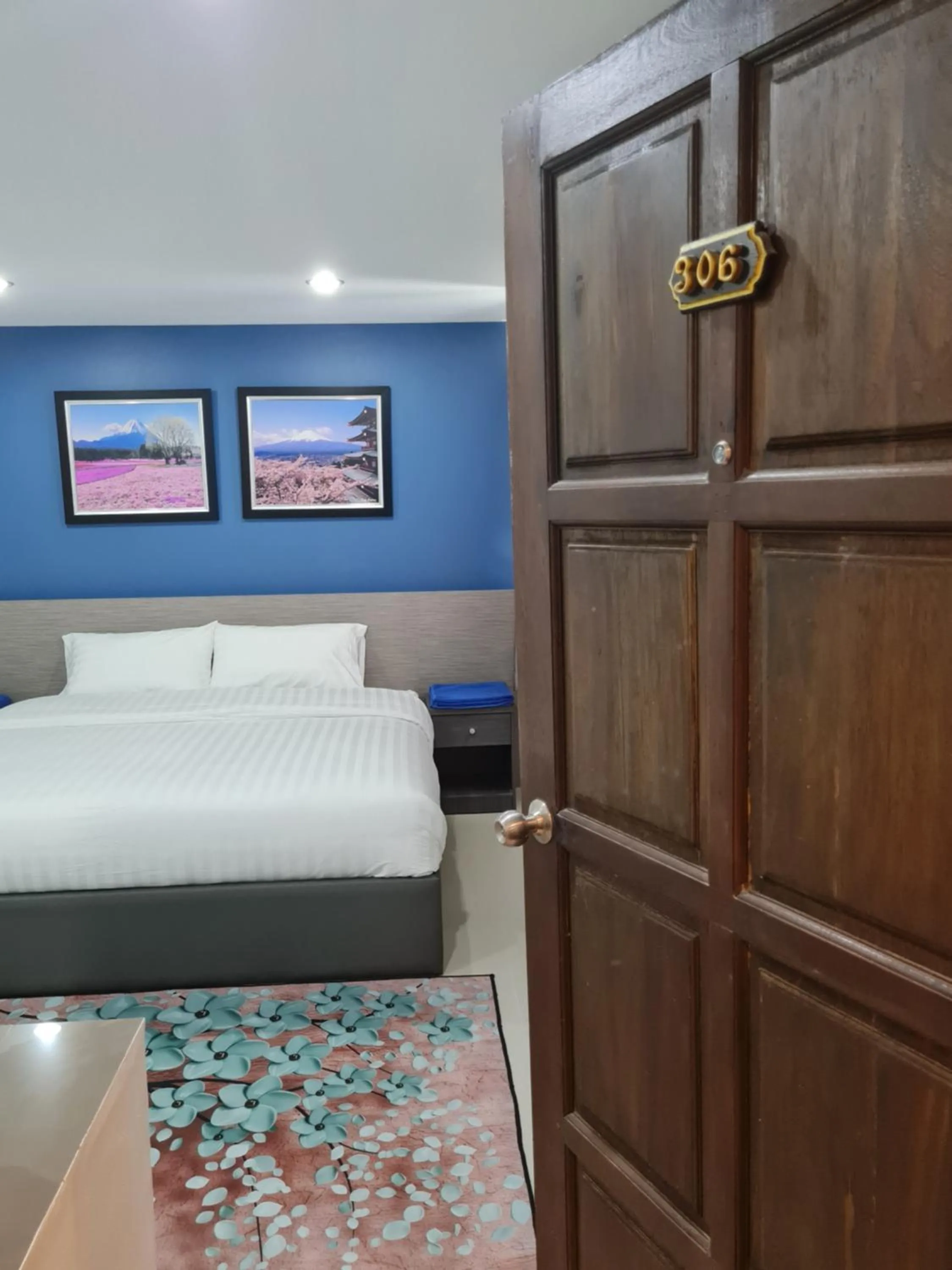 Bed in Poonsuk Place Hotel