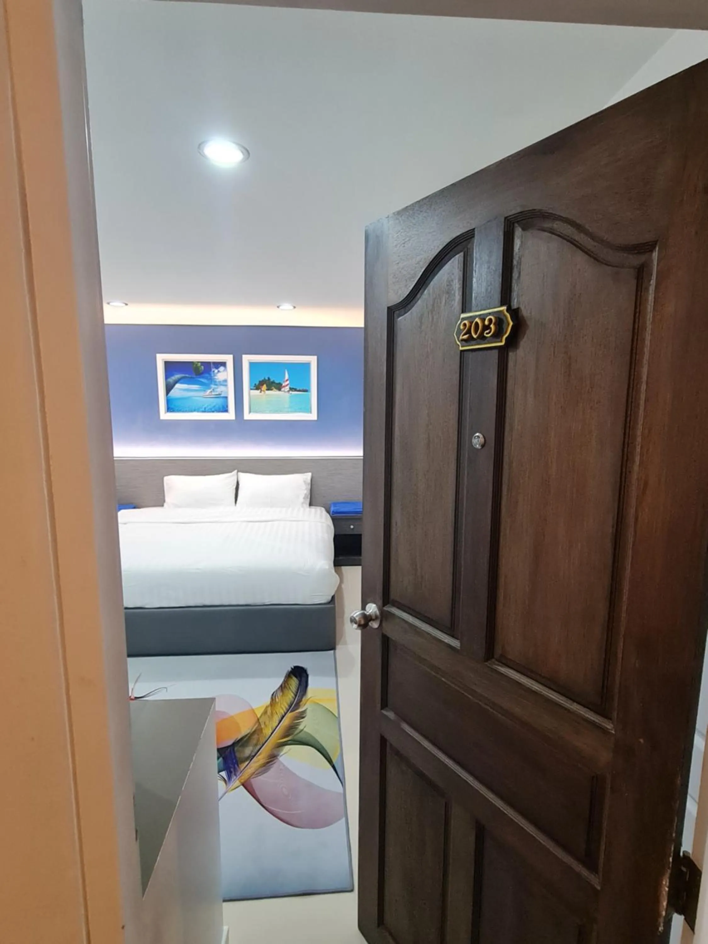 Bed in Poonsuk Place Hotel