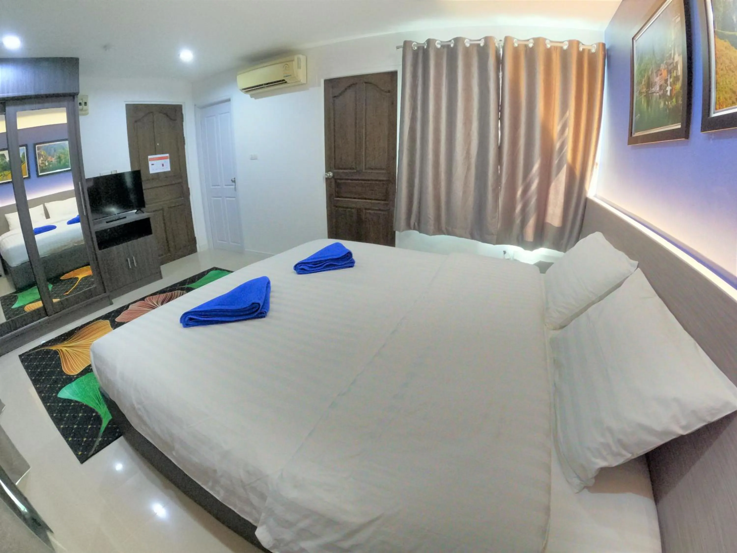 Bed in Poonsuk Place Hotel