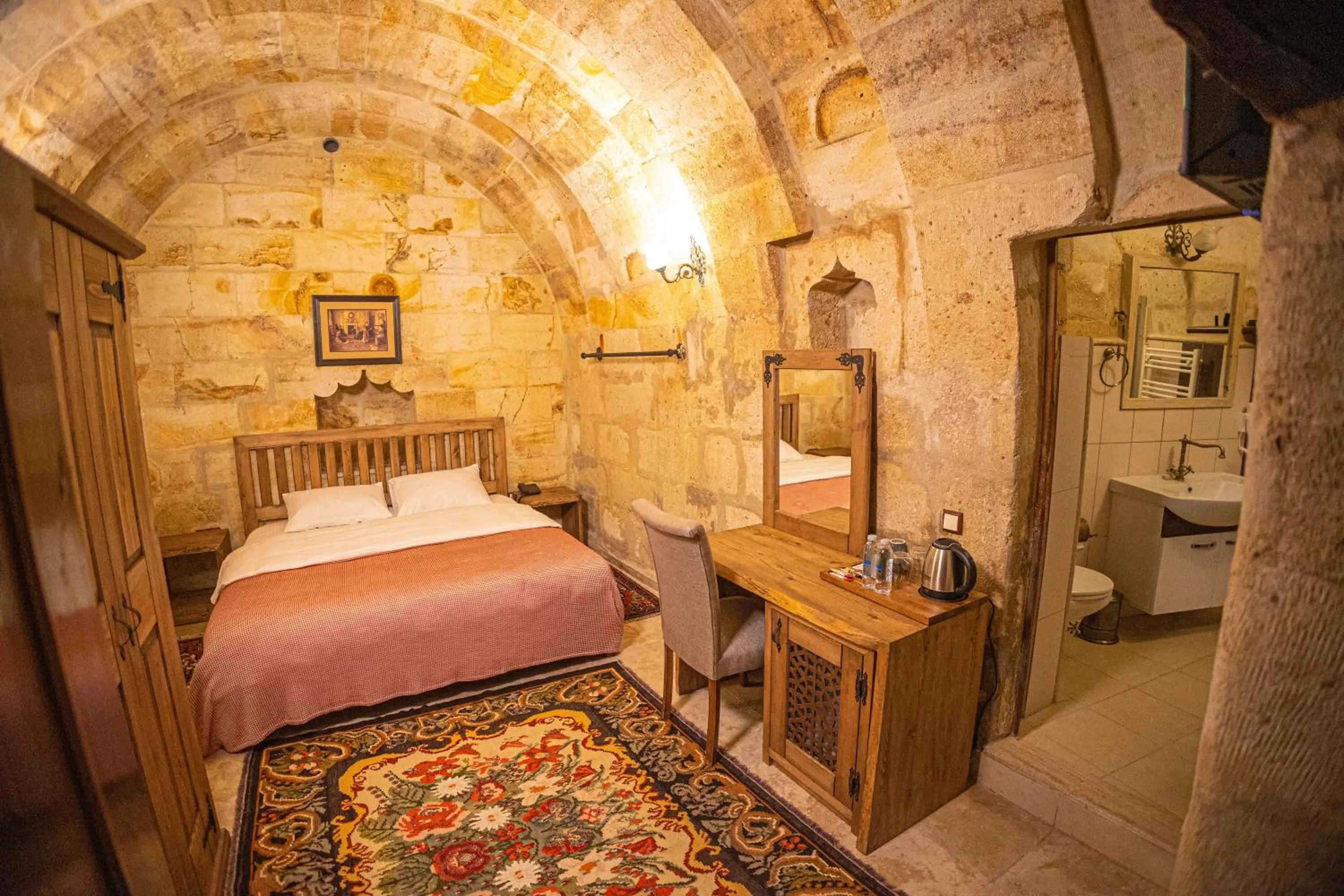 Bed in Pietra Cave Suites