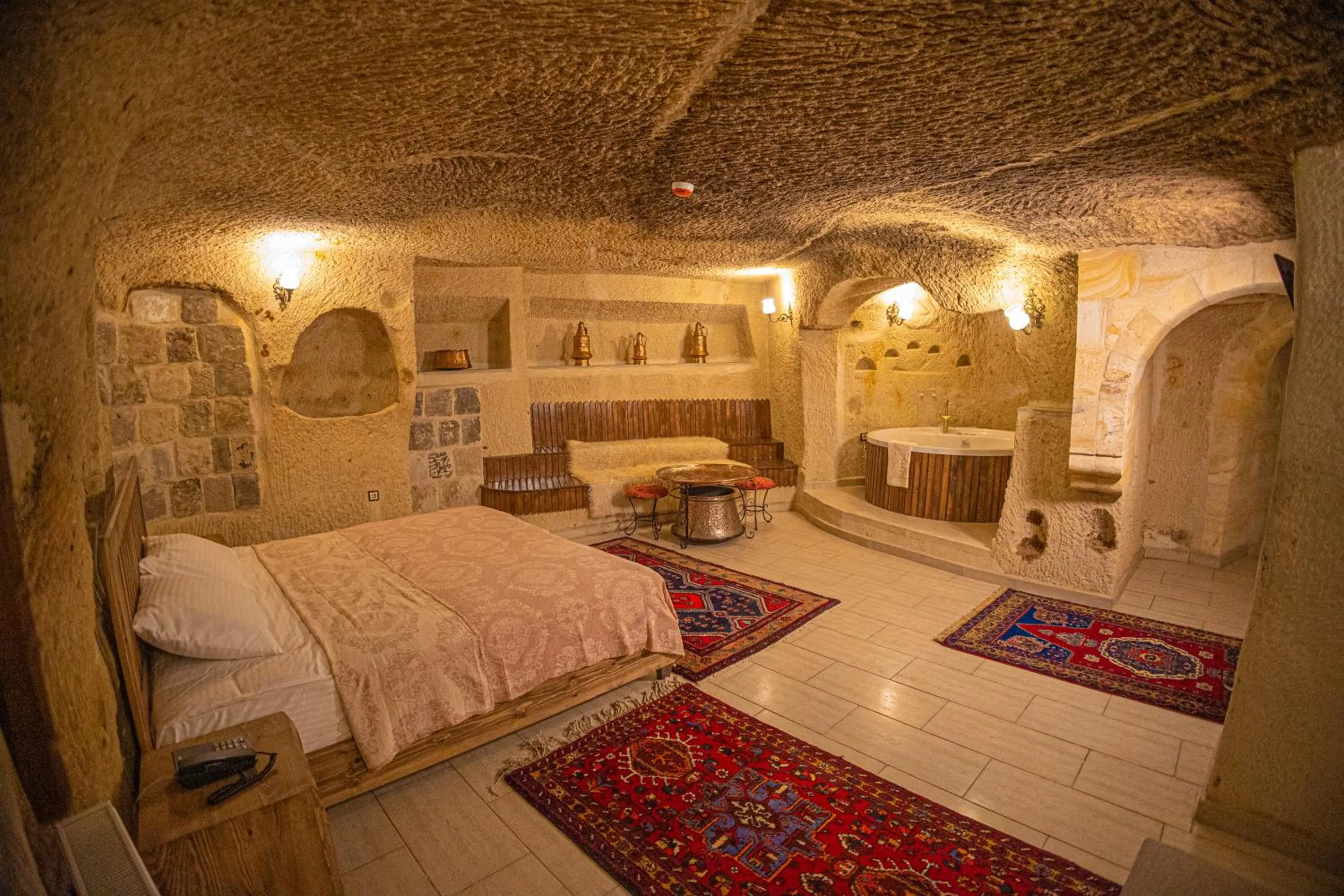 Bed in Pietra Cave Suites