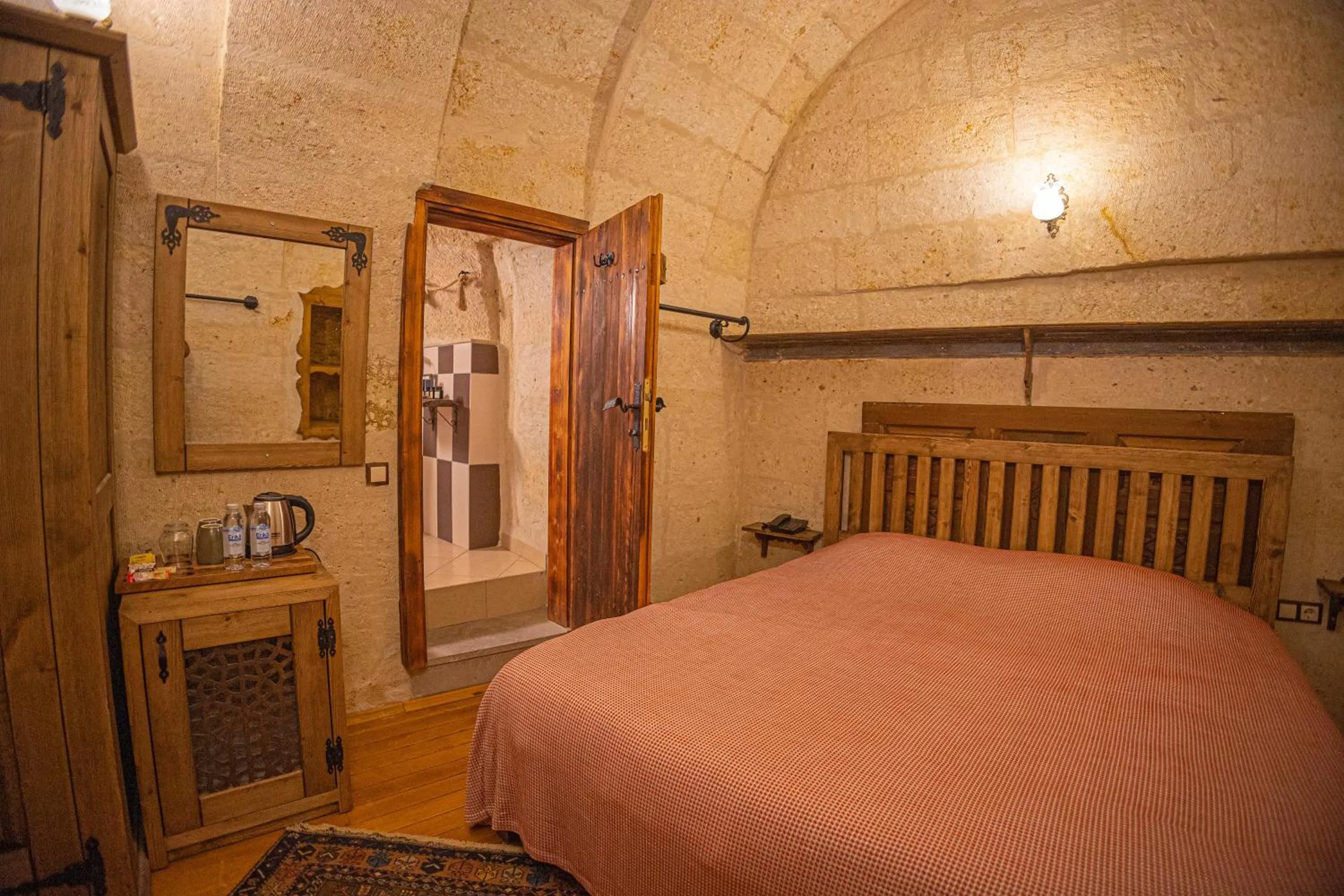 Bed in Pietra Cave Suites