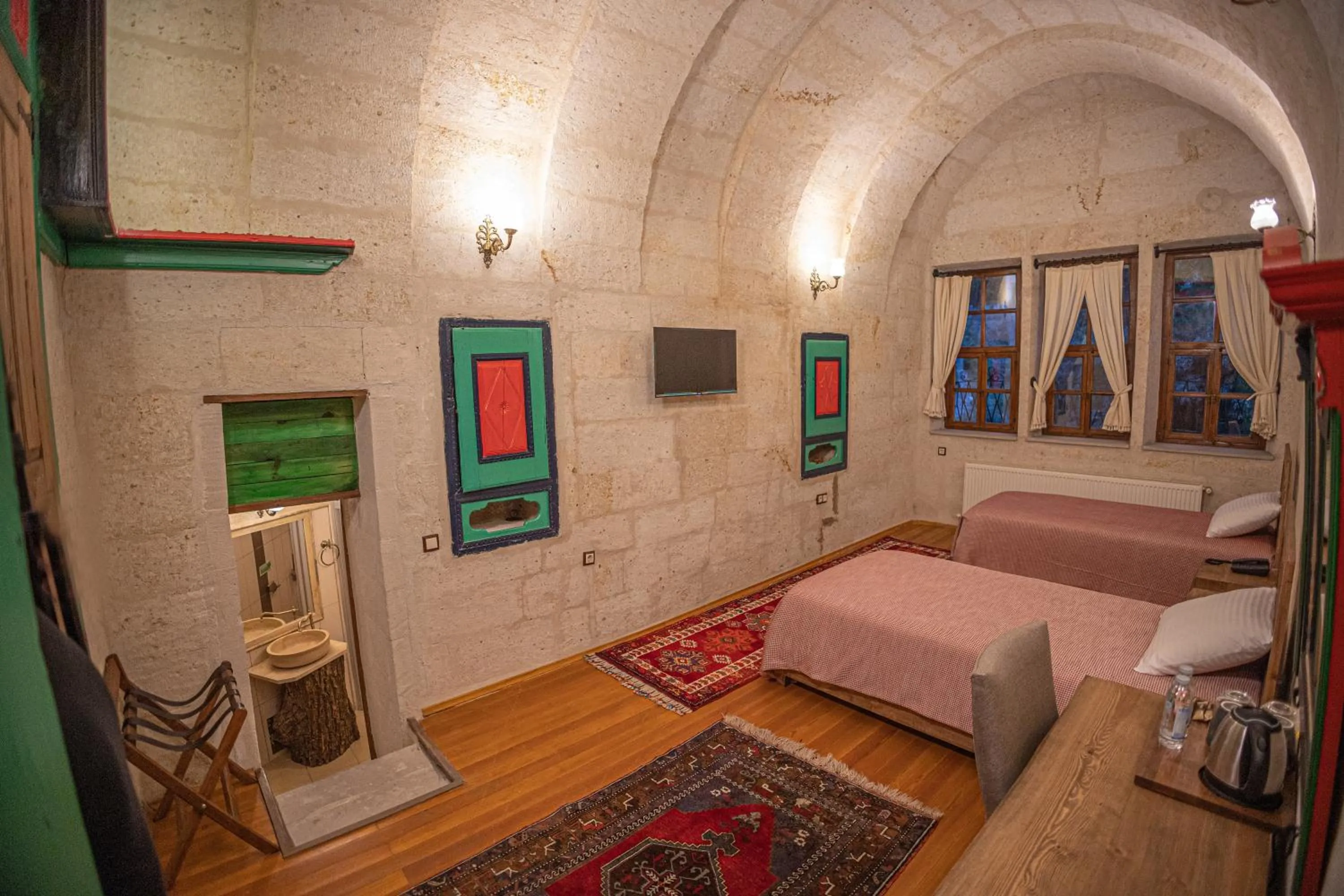 Bed in Pietra Cave Suites