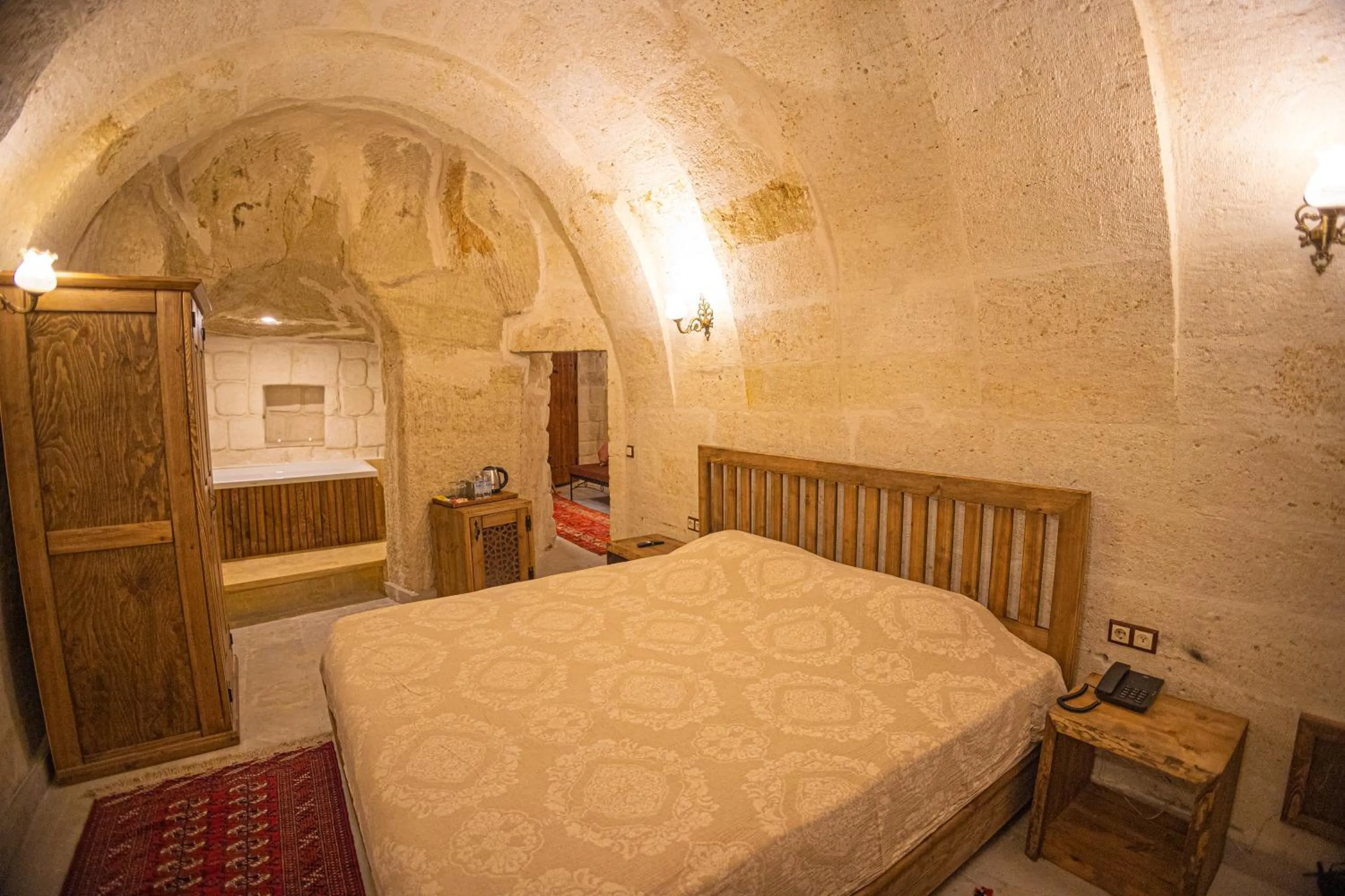 Bed in Pietra Cave Suites