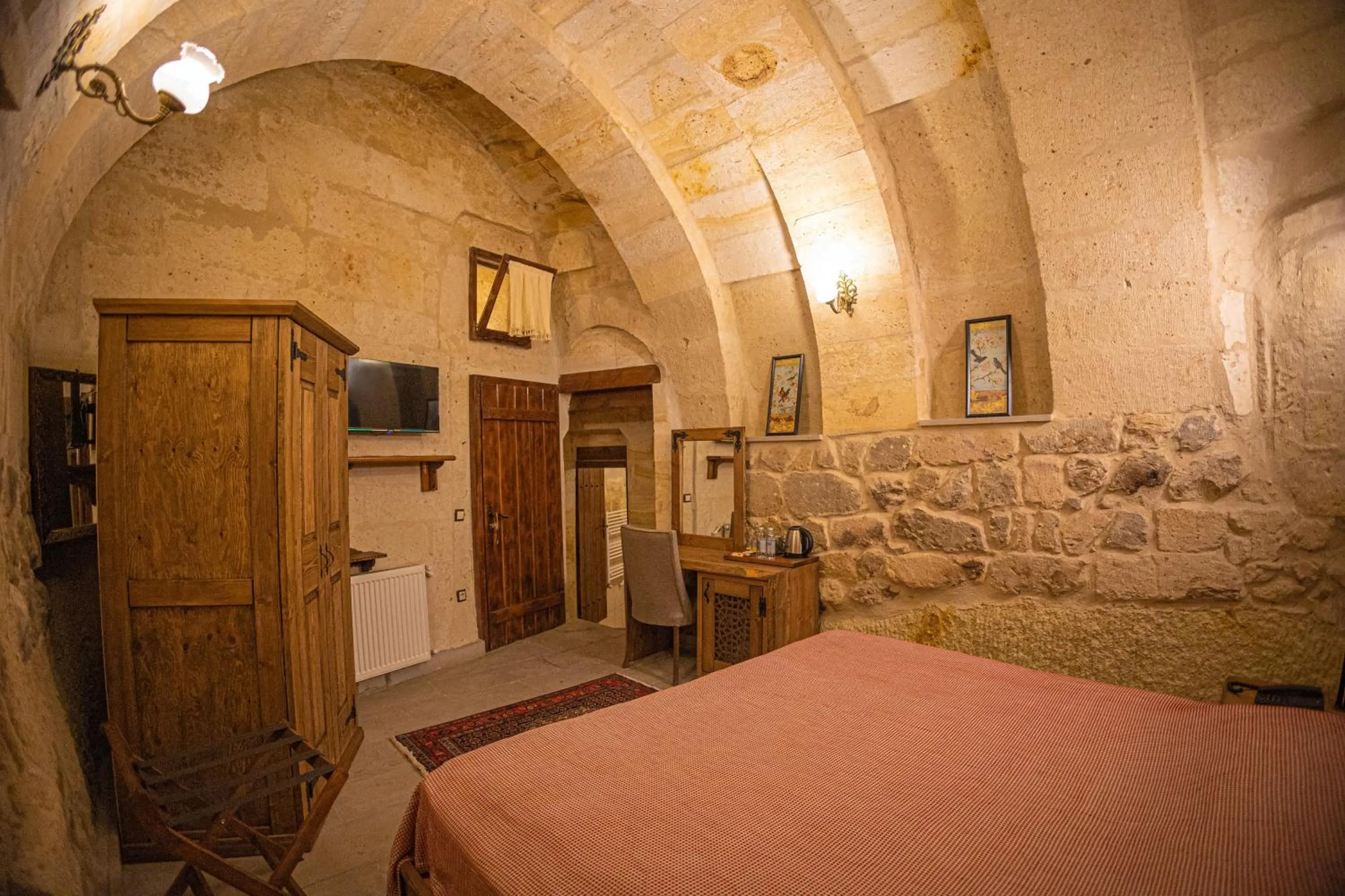 Bed in Pietra Cave Suites