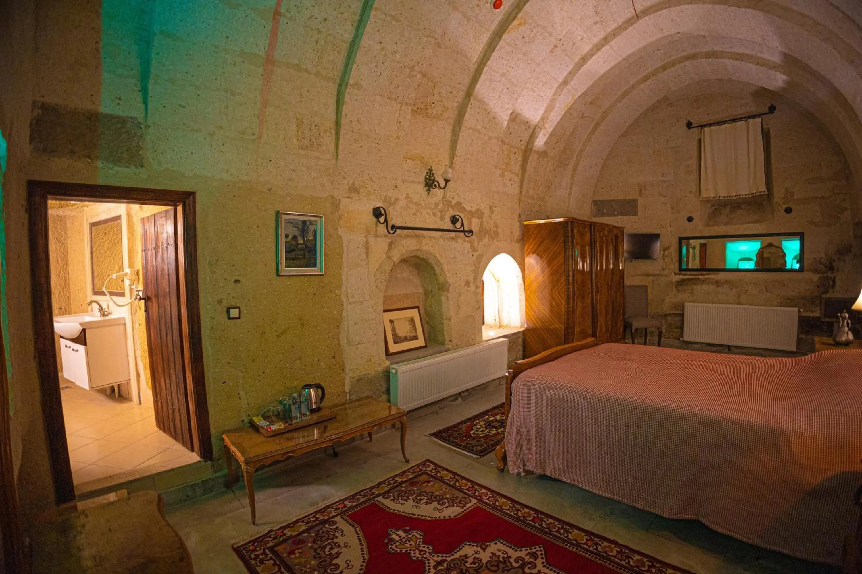 Bed in Pietra Cave Suites