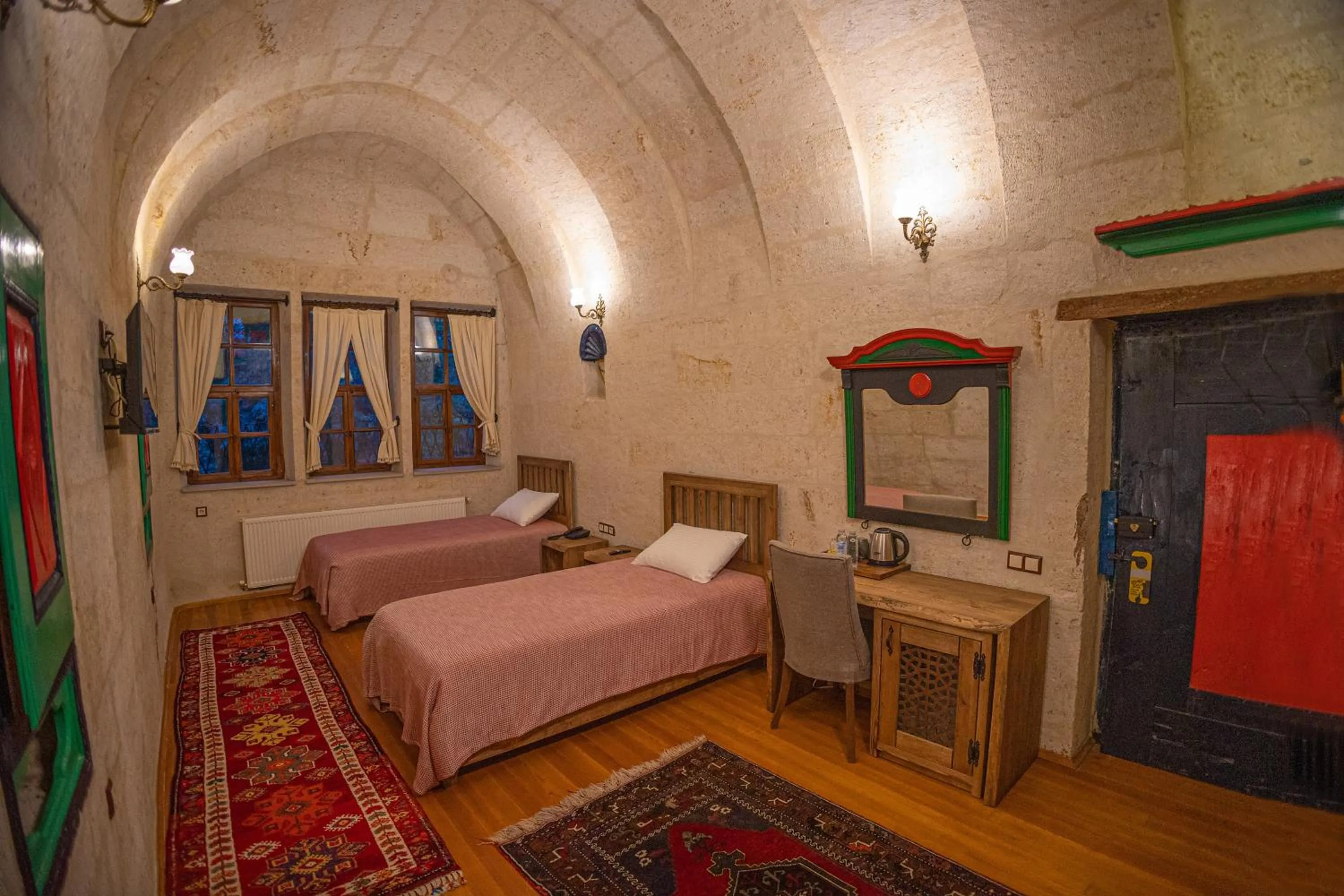 Bed in Pietra Cave Suites