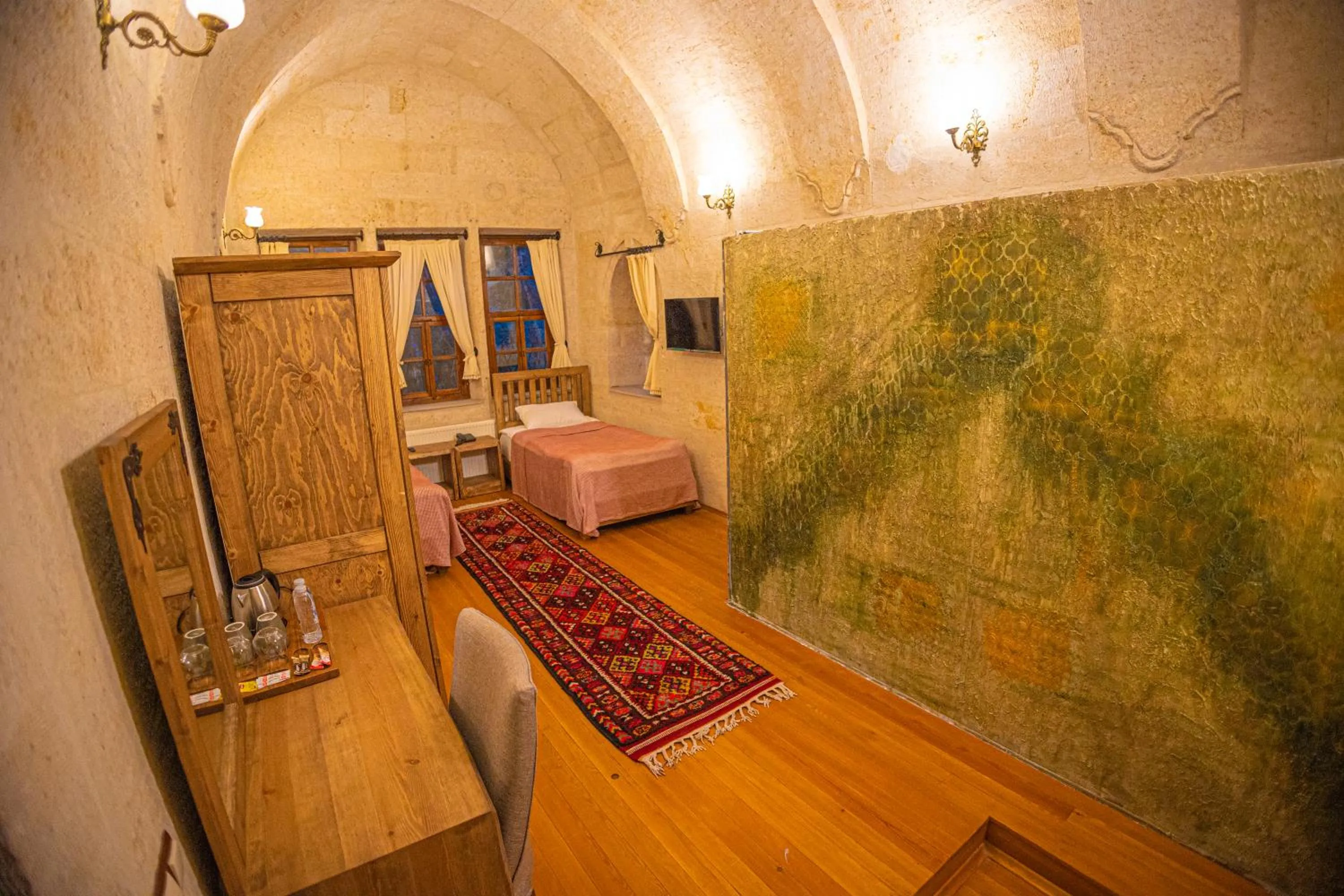 Bed in Pietra Cave Suites