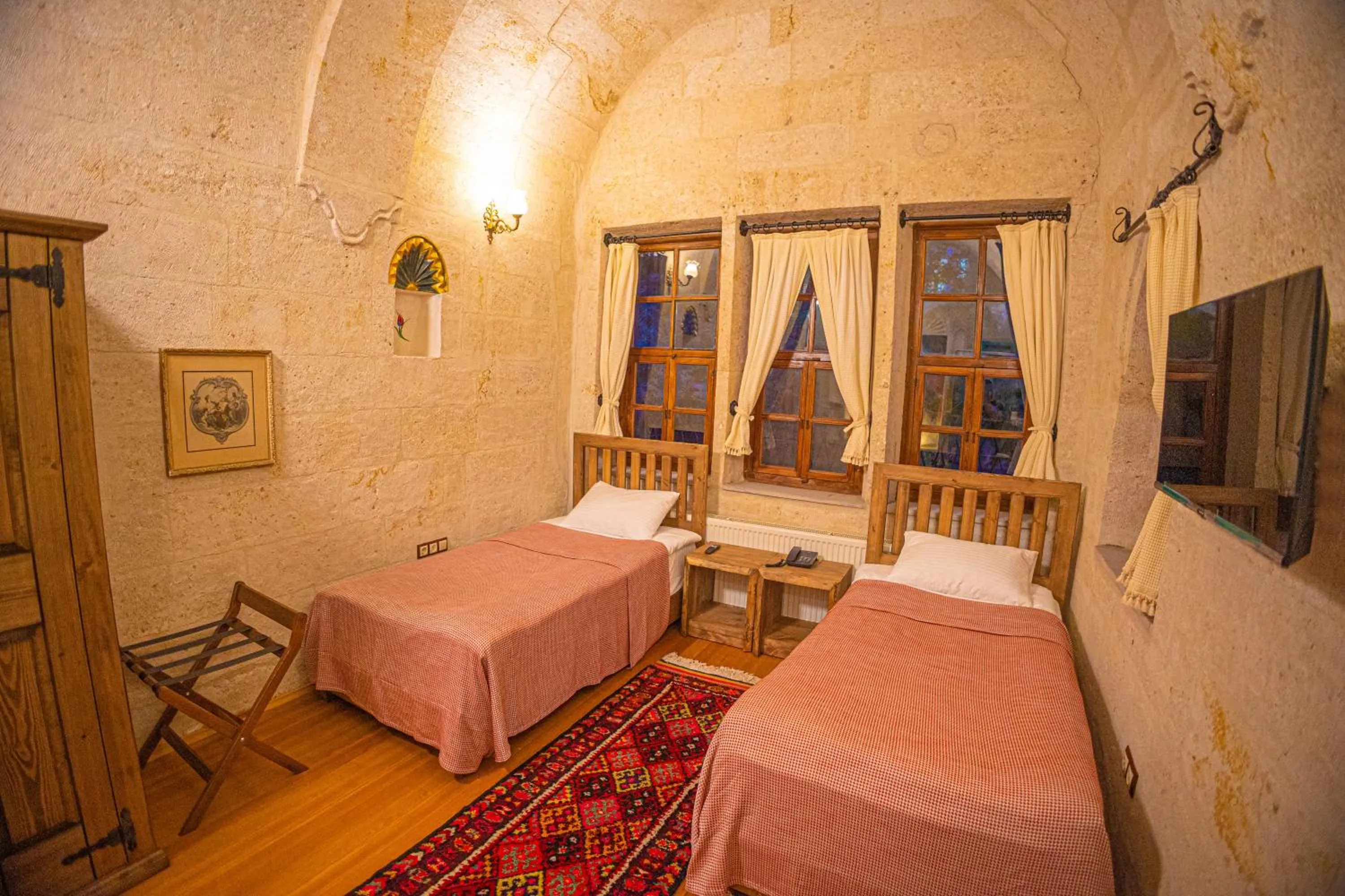 Bed in Pietra Cave Suites