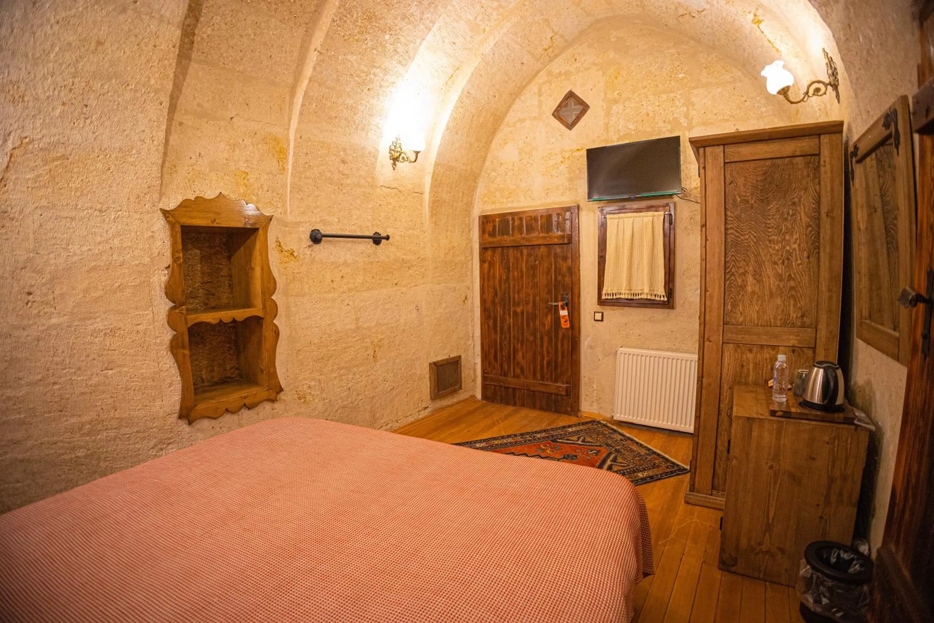 Bed in Pietra Cave Suites