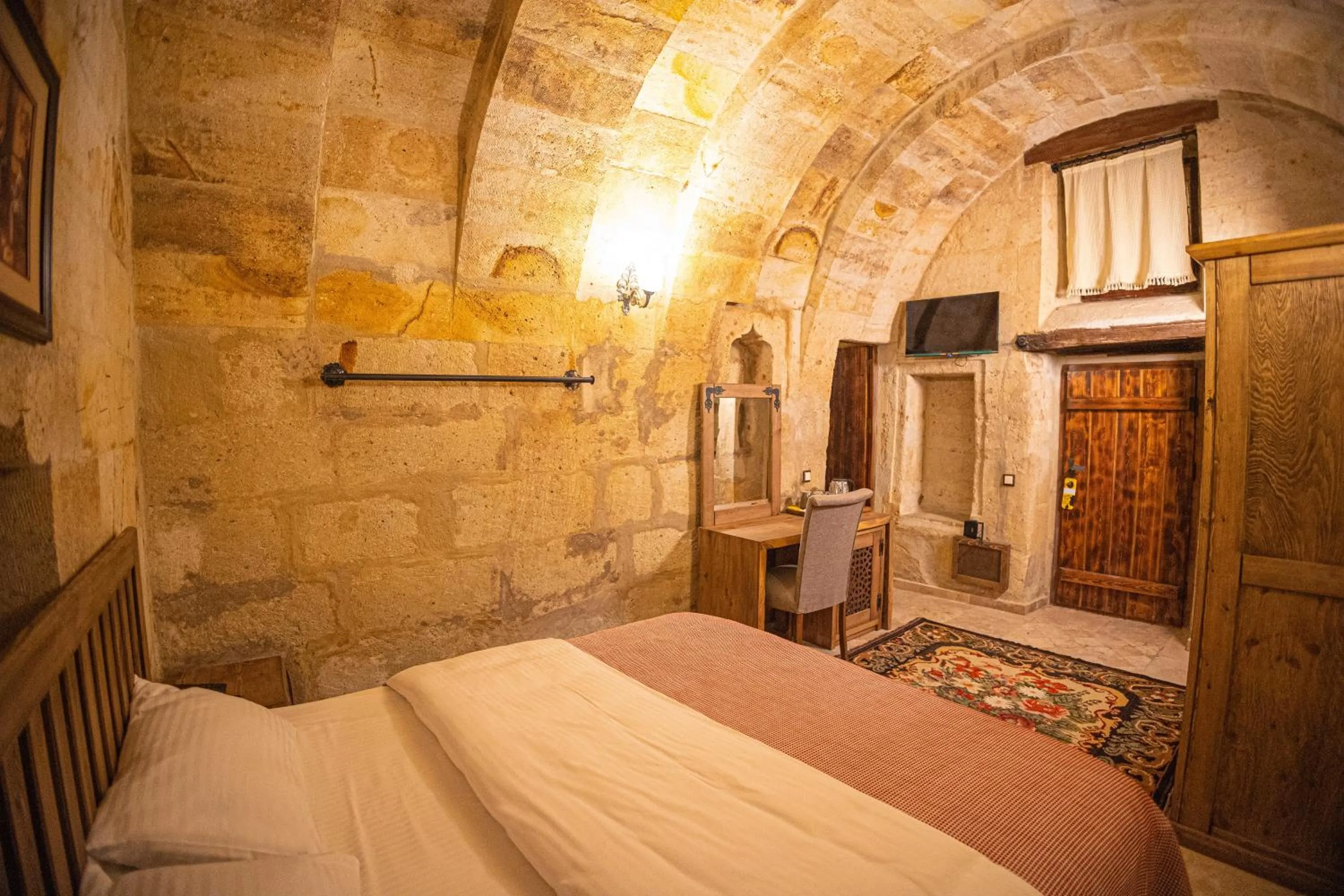 Bed in Pietra Cave Suites