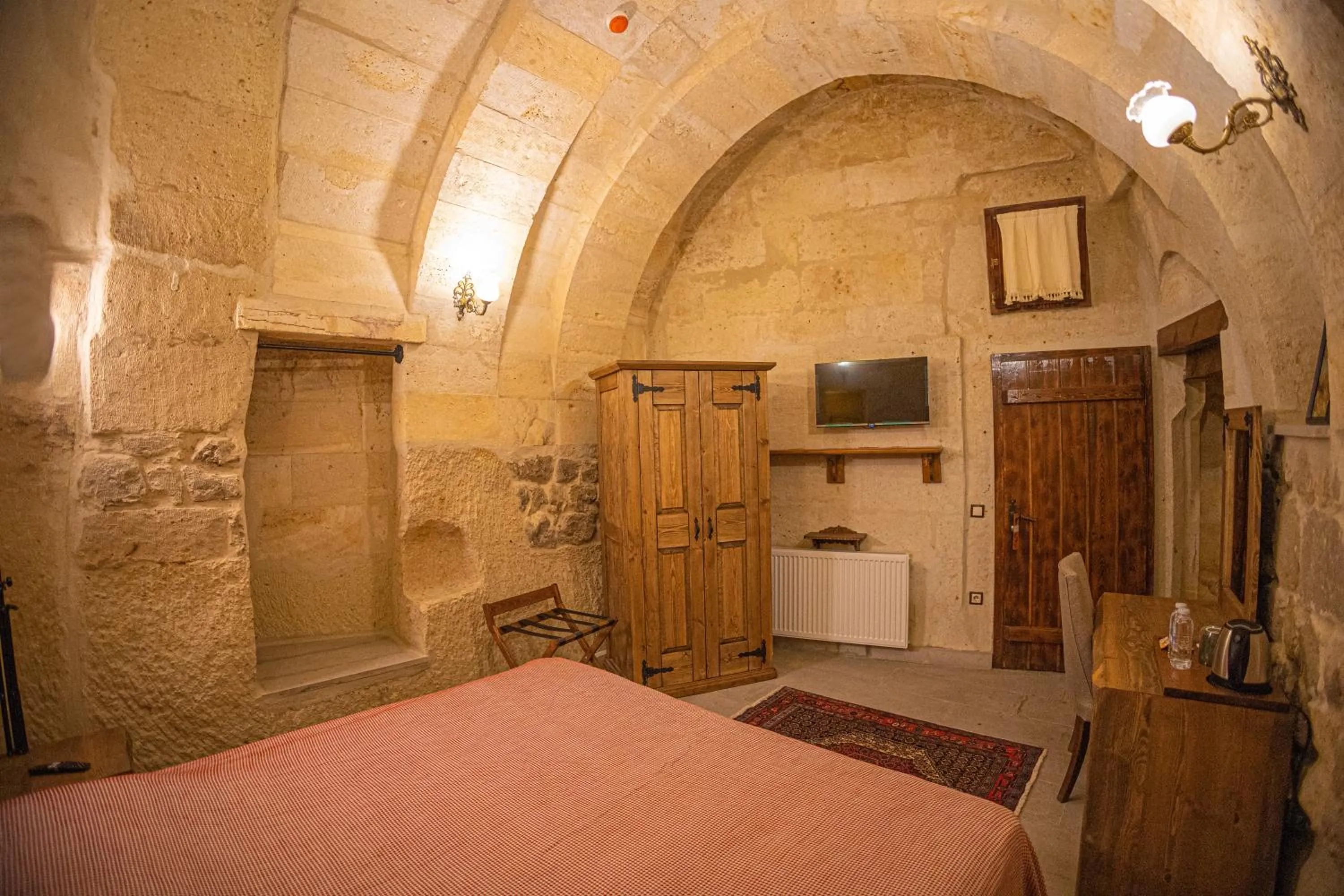 Bed in Pietra Cave Suites