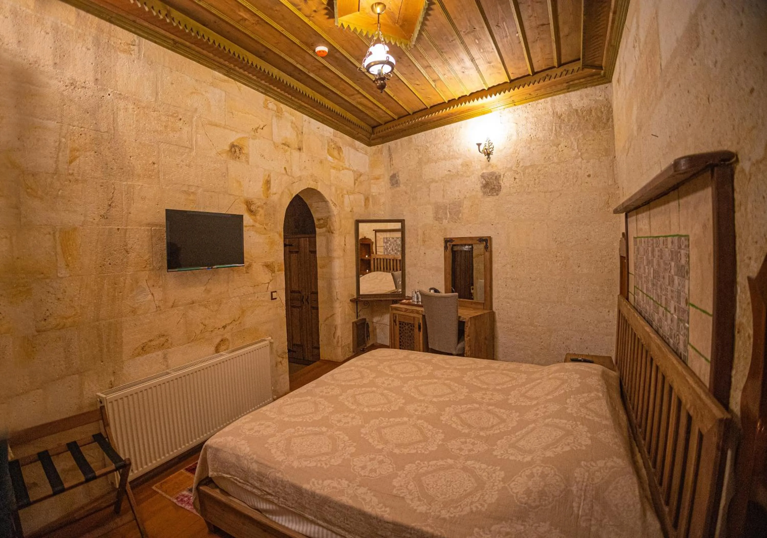 Bed in Pietra Cave Suites