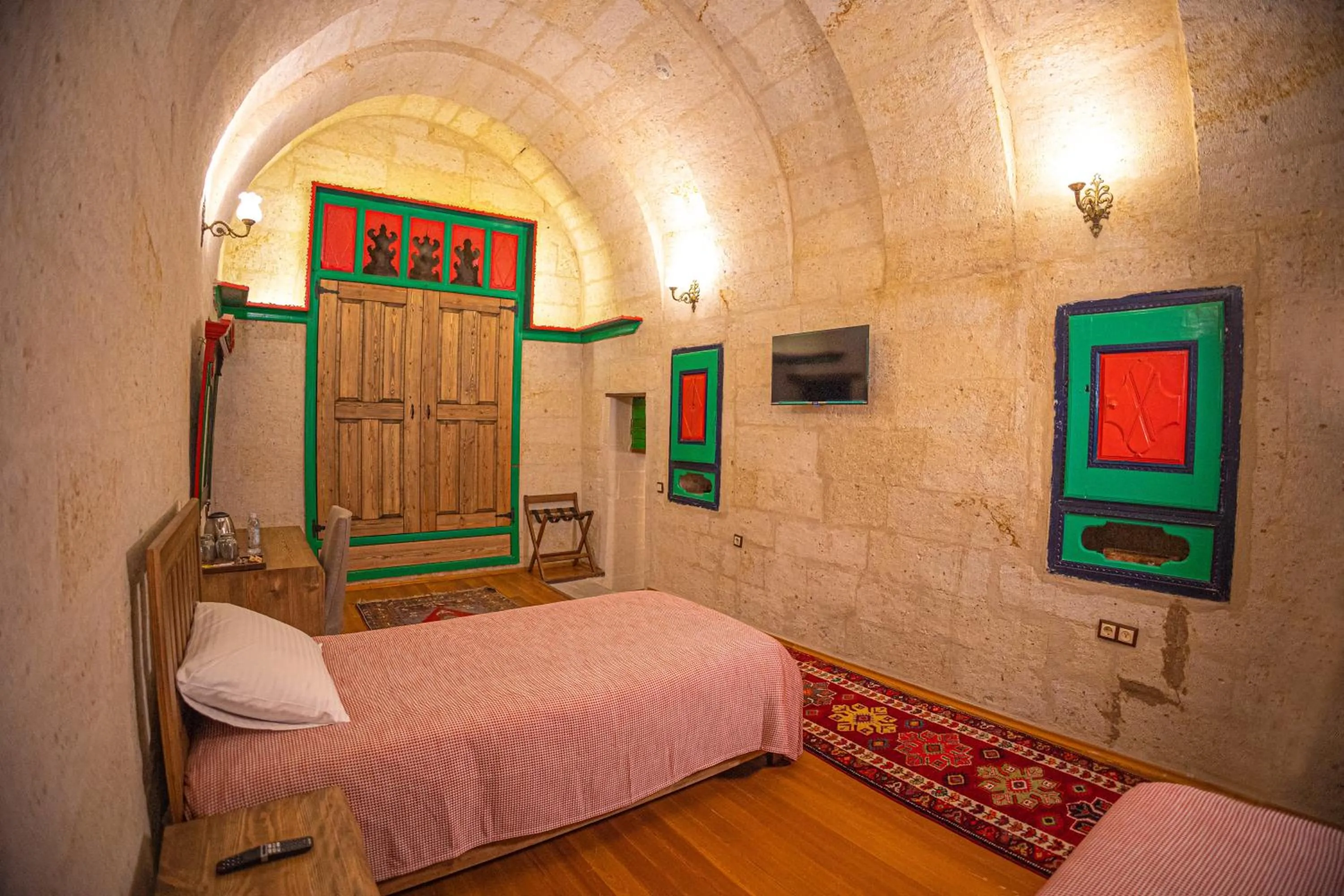 Bed in Pietra Cave Suites