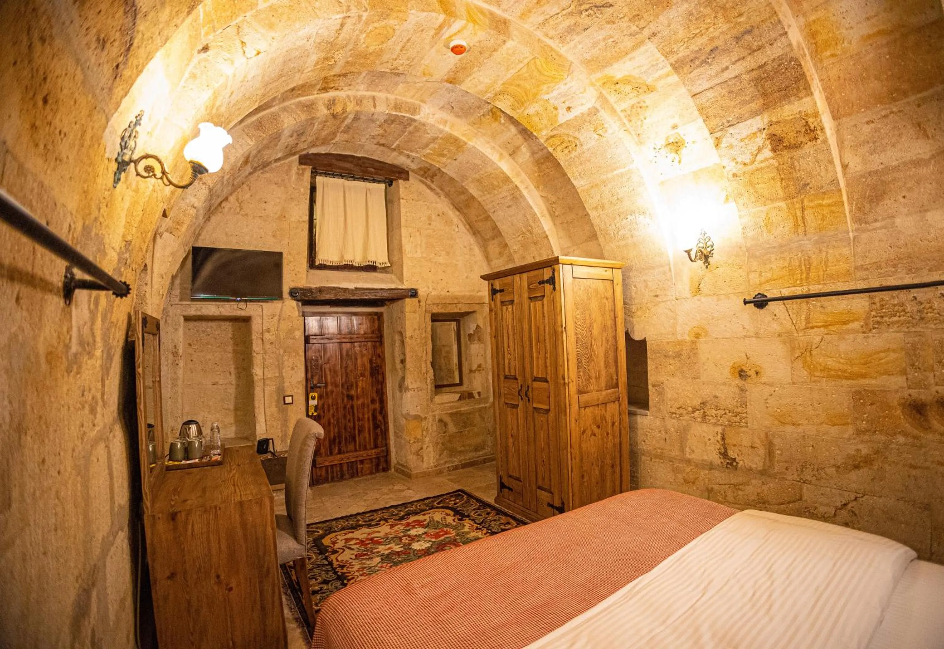 Bed in Pietra Cave Suites