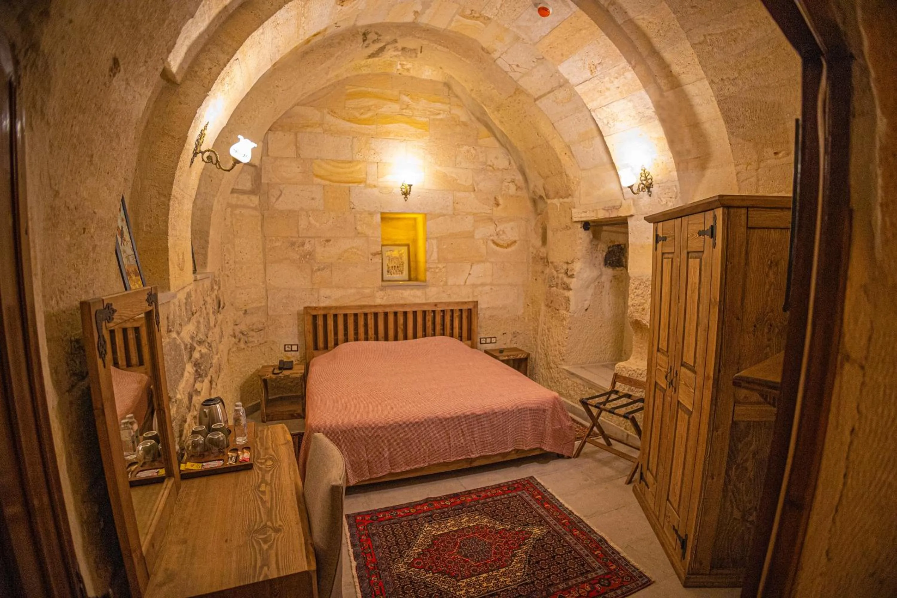 Bed in Pietra Cave Suites