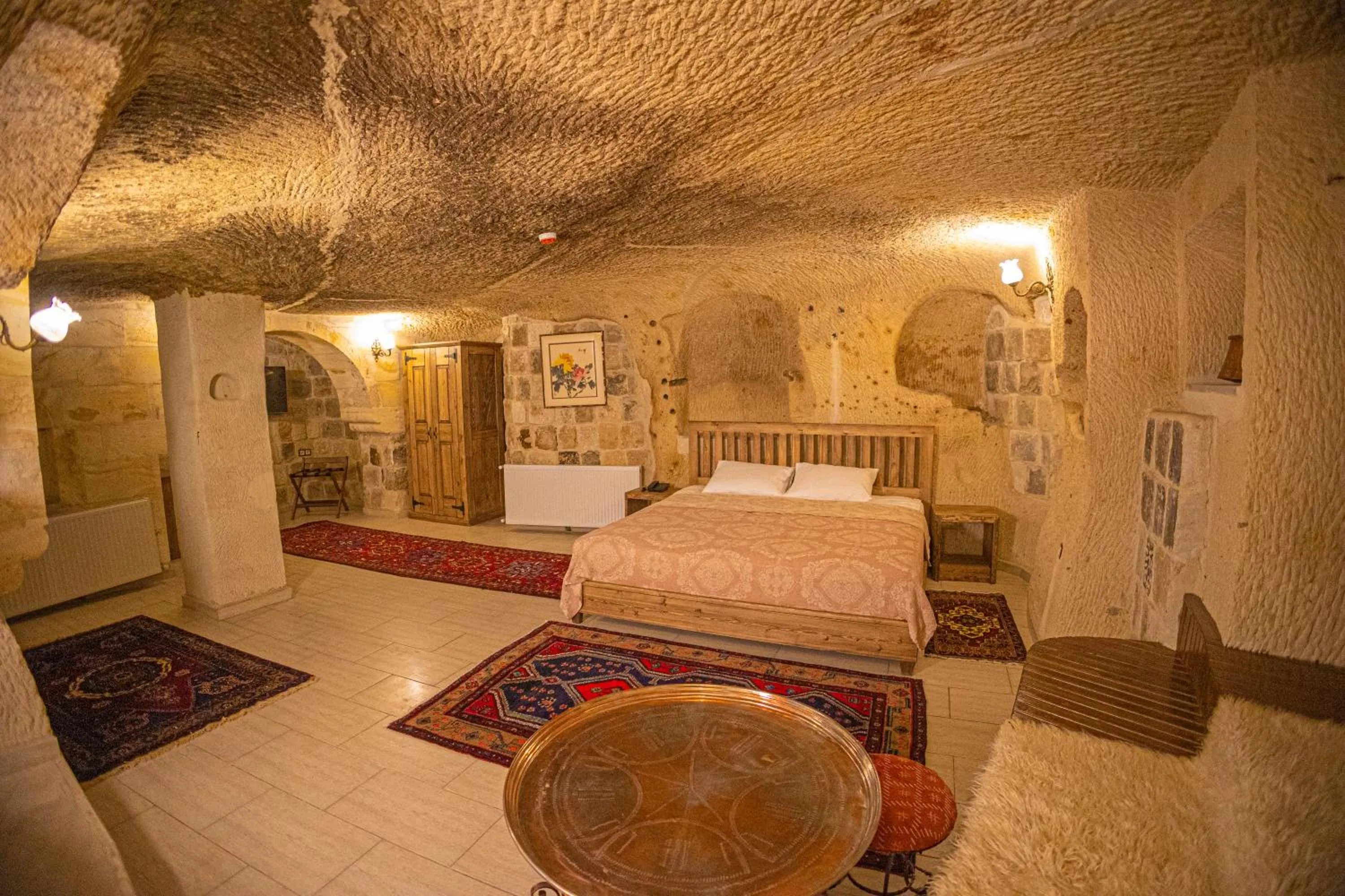 Bed in Pietra Cave Suites