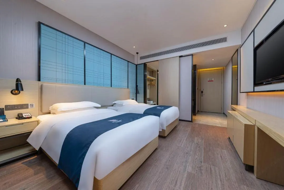 Bed in Echarm Hotel Foshan Guangfo Road Jiaokou Metro Station