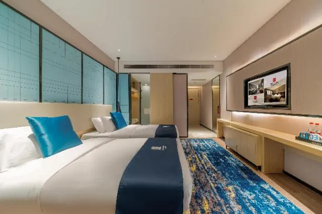 Bed in Echarm Hotel Foshan Guangfo Road Jiaokou Metro Station