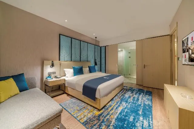 Bed in Echarm Hotel Foshan Guangfo Road Jiaokou Metro Station