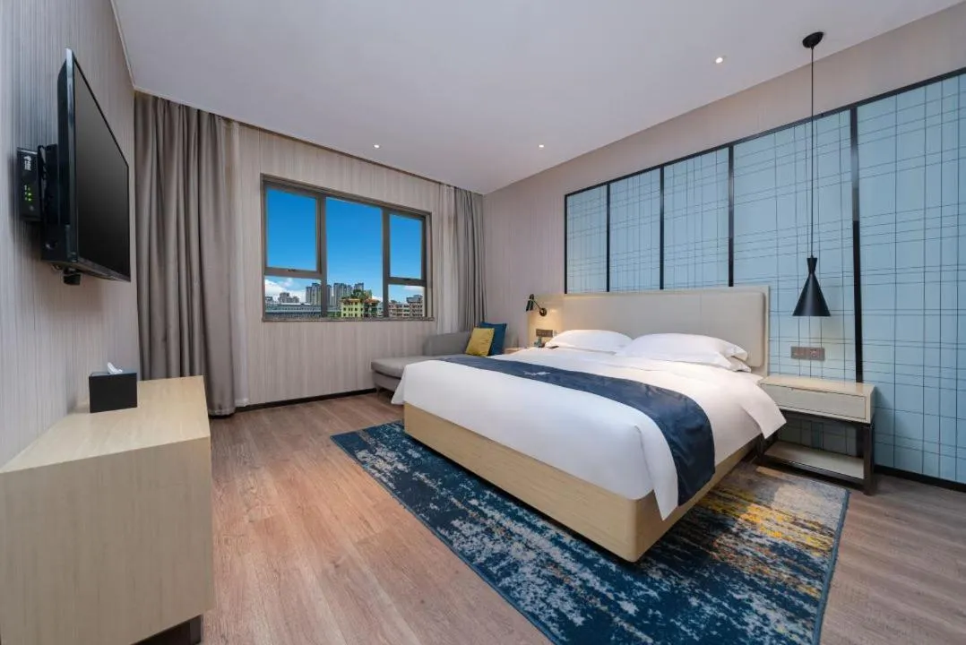 Bed in Echarm Hotel Foshan Guangfo Road Jiaokou Metro Station