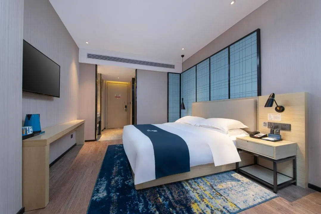 Bed in Echarm Hotel Foshan Guangfo Road Jiaokou Metro Station