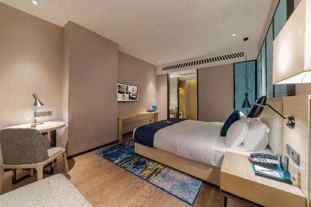 Bed in Echarm Hotel Foshan Guangfo Road Jiaokou Metro Station