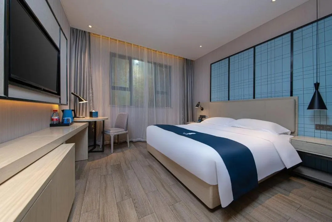 Bed in Echarm Hotel Foshan Guangfo Road Jiaokou Metro Station