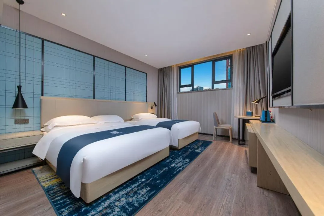 Bed in Echarm Hotel Foshan Guangfo Road Jiaokou Metro Station