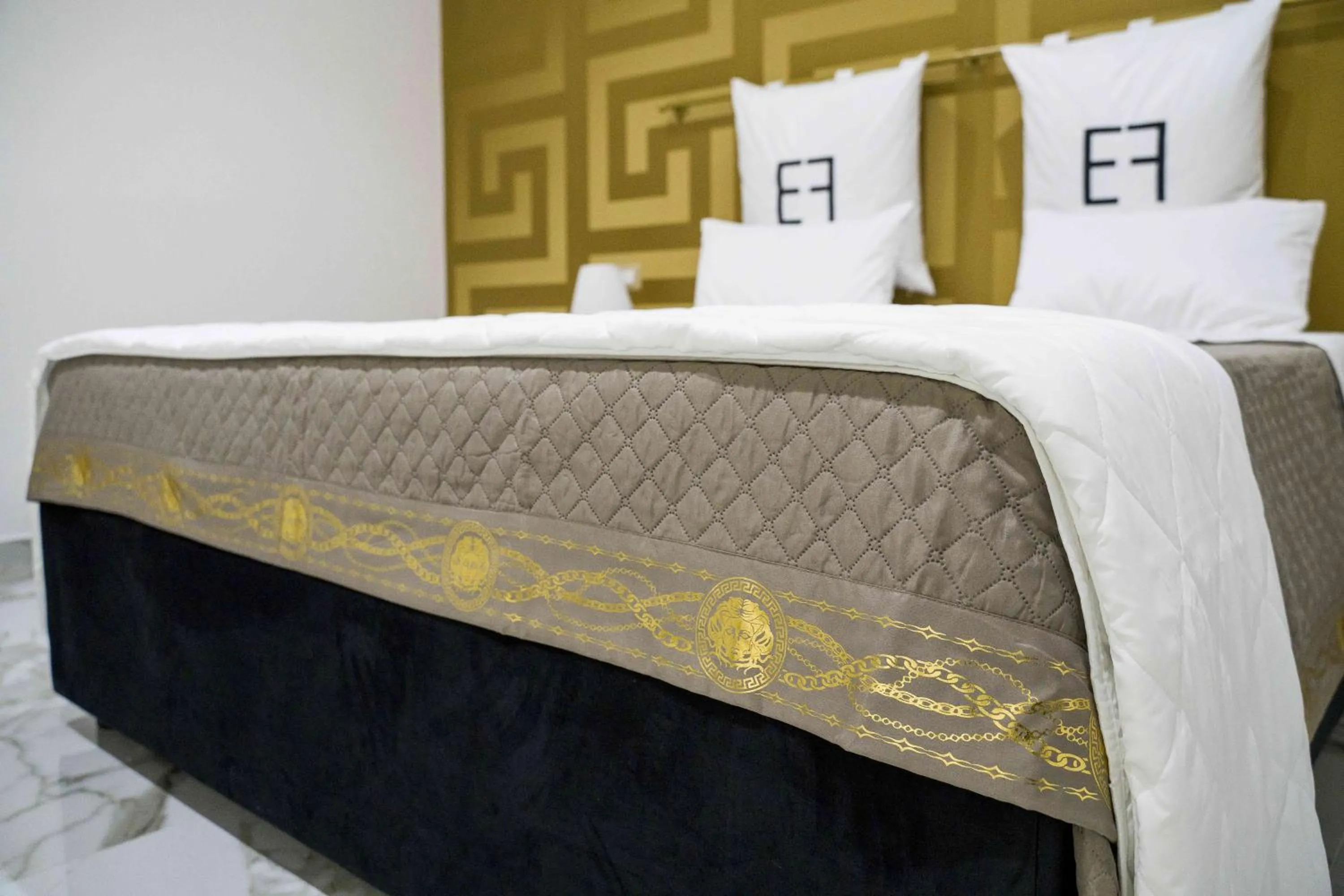 Bed in EF LUXURY LIVING RESORT AND SPA