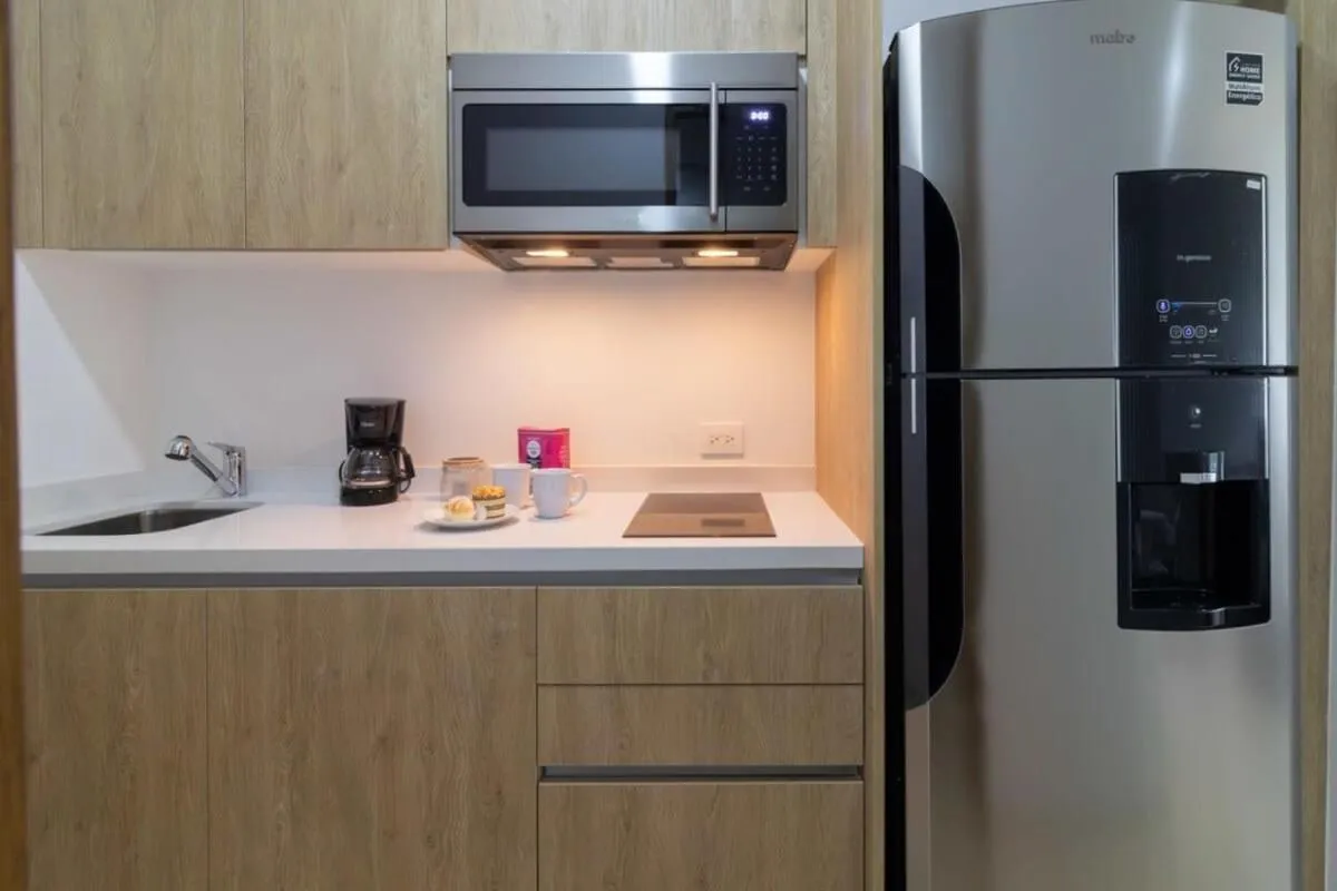 Kitchen or kitchenette in Oceanview Infinity Pool, Steps to 5th Ave & Beach