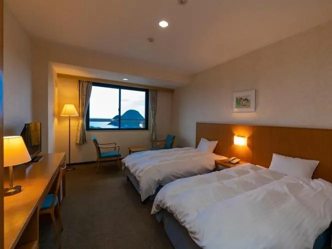 Bed in Kyukamura Takeno-Kaigan