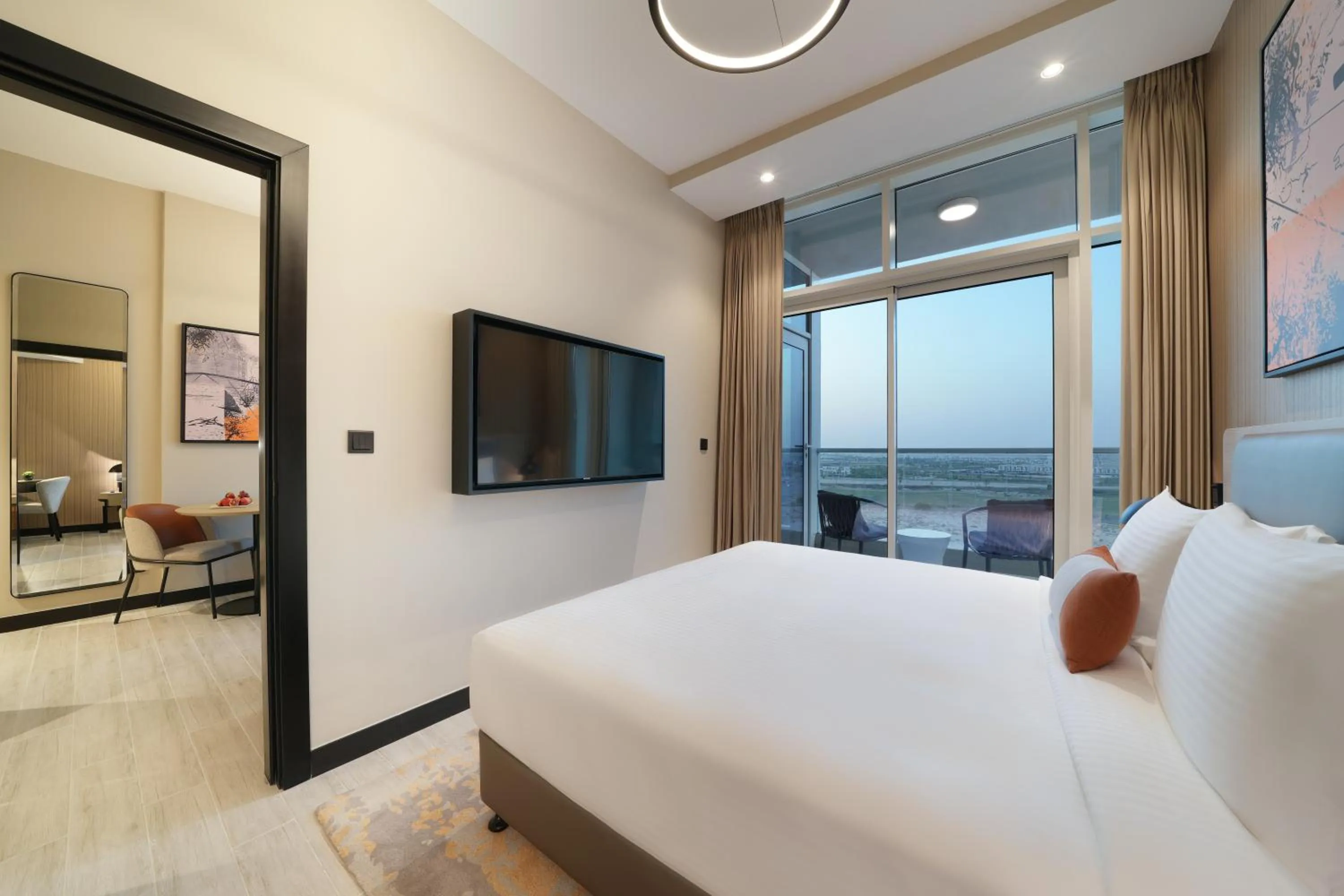 Bed in DAMAC Hills 2 Hotel, an Edge by Rotana Hotel