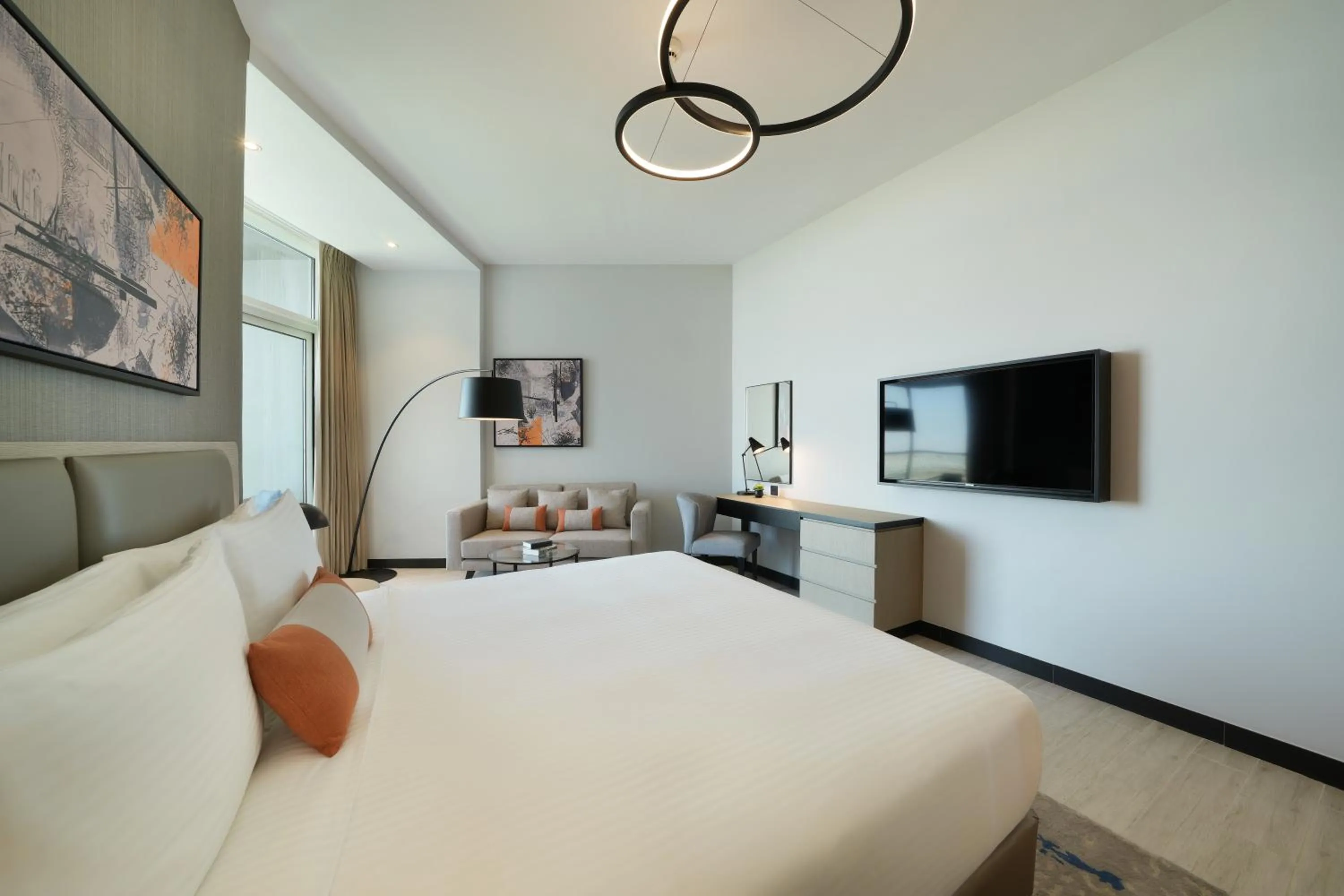 Bed in DAMAC Hills 2 Hotel, an Edge by Rotana Hotel