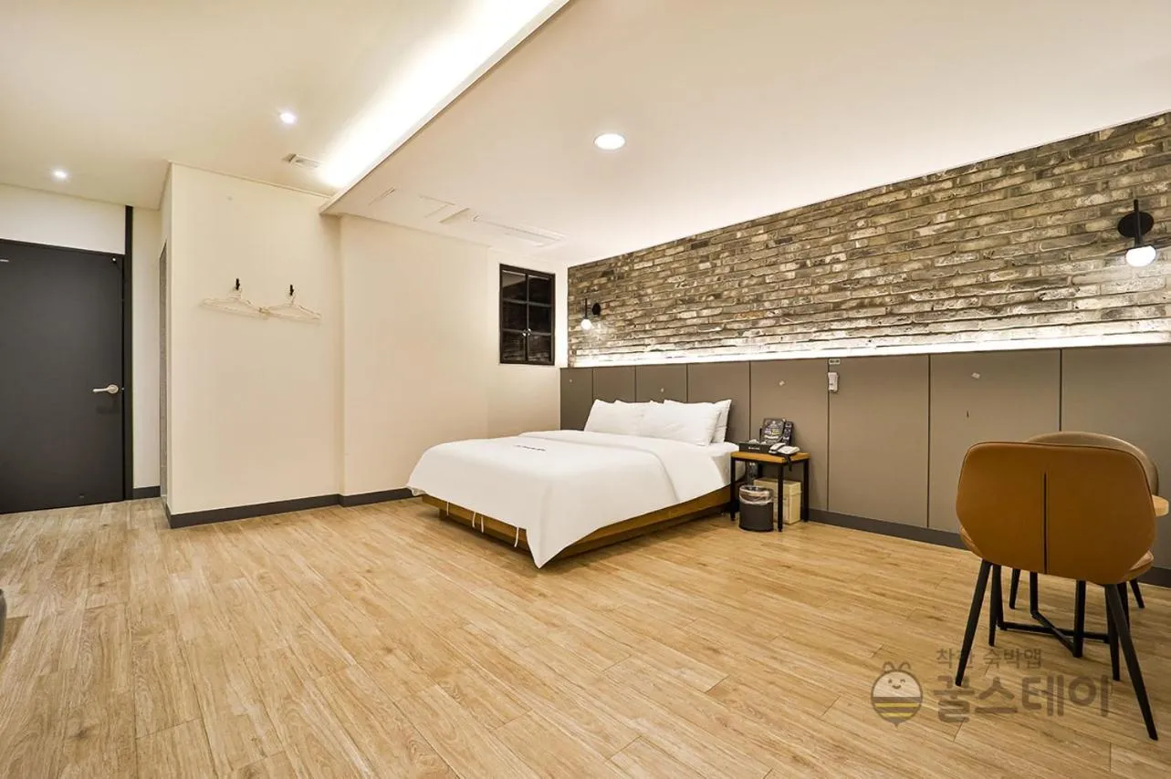 Bed in Brown Dot Hotel Guun