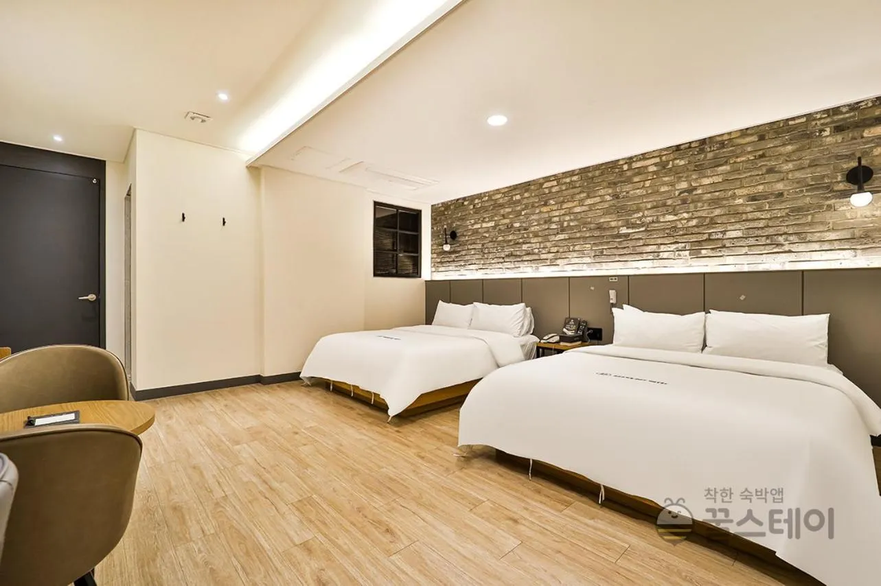 Bed in Brown Dot Hotel Guun