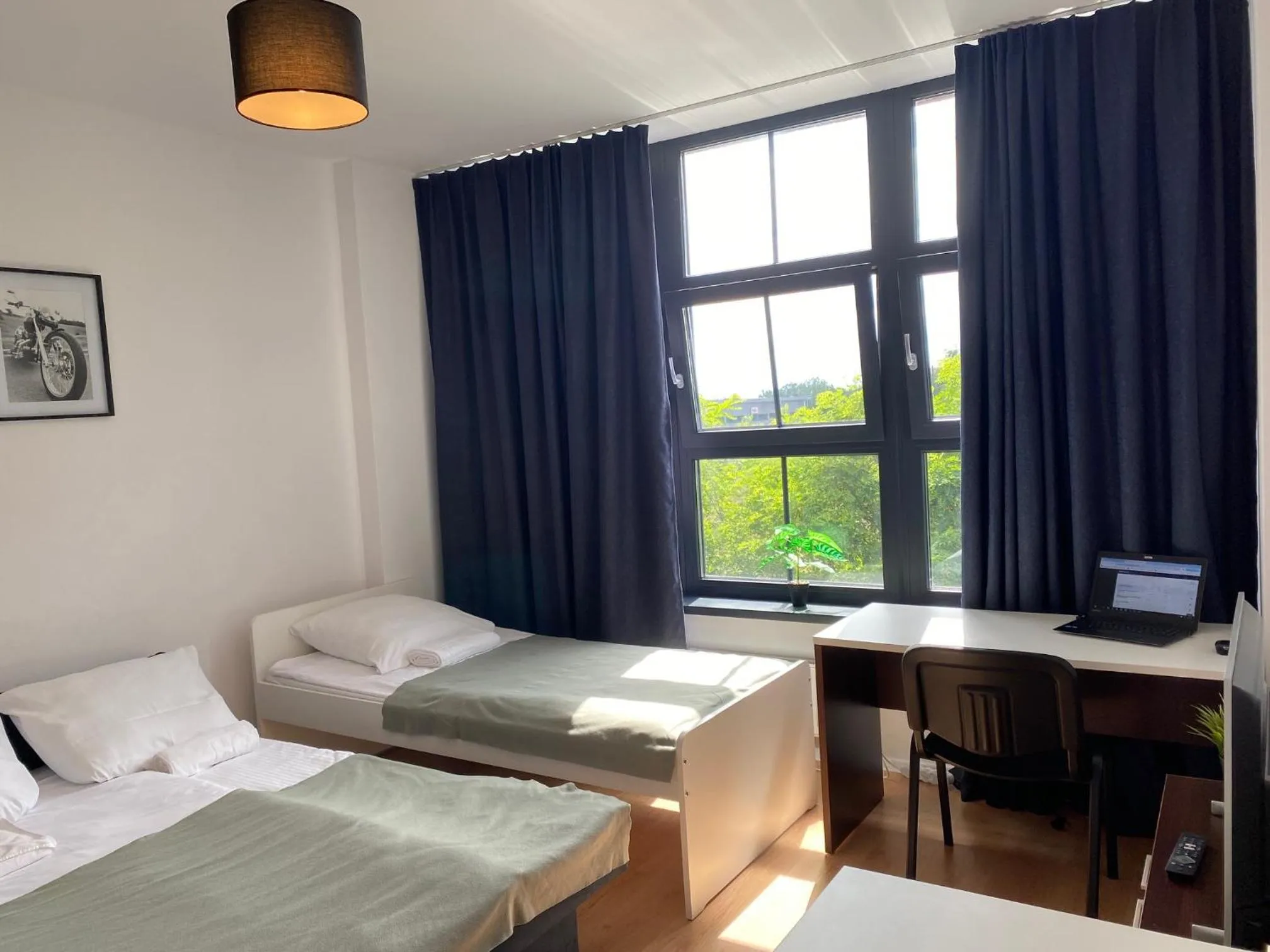 Bed in SleepWell Apartments